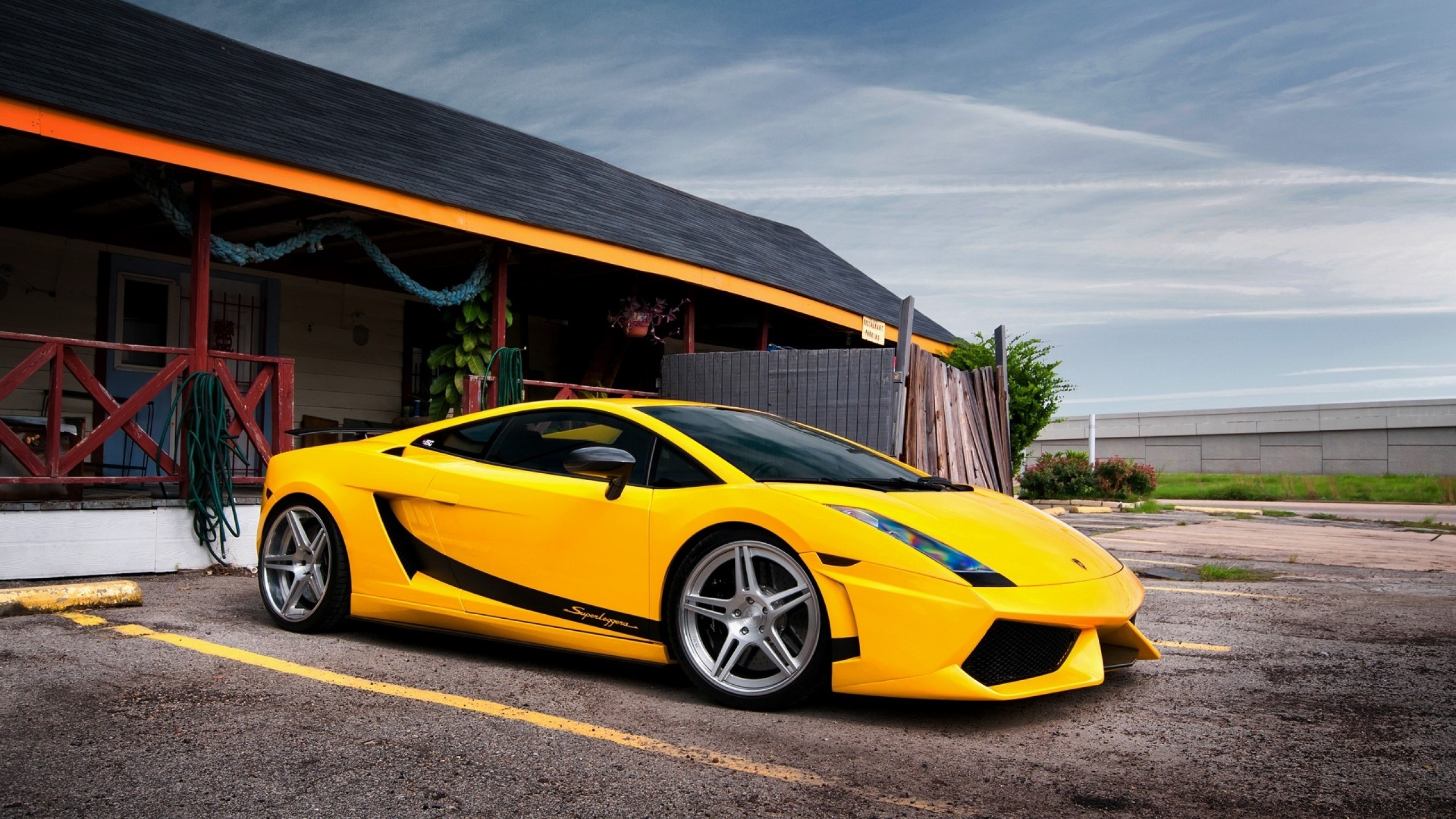 Wallpaper Yellow Lamborghini Aventador Parked Near Brown Wooden Building  During Daytime, Background - Download Free Image