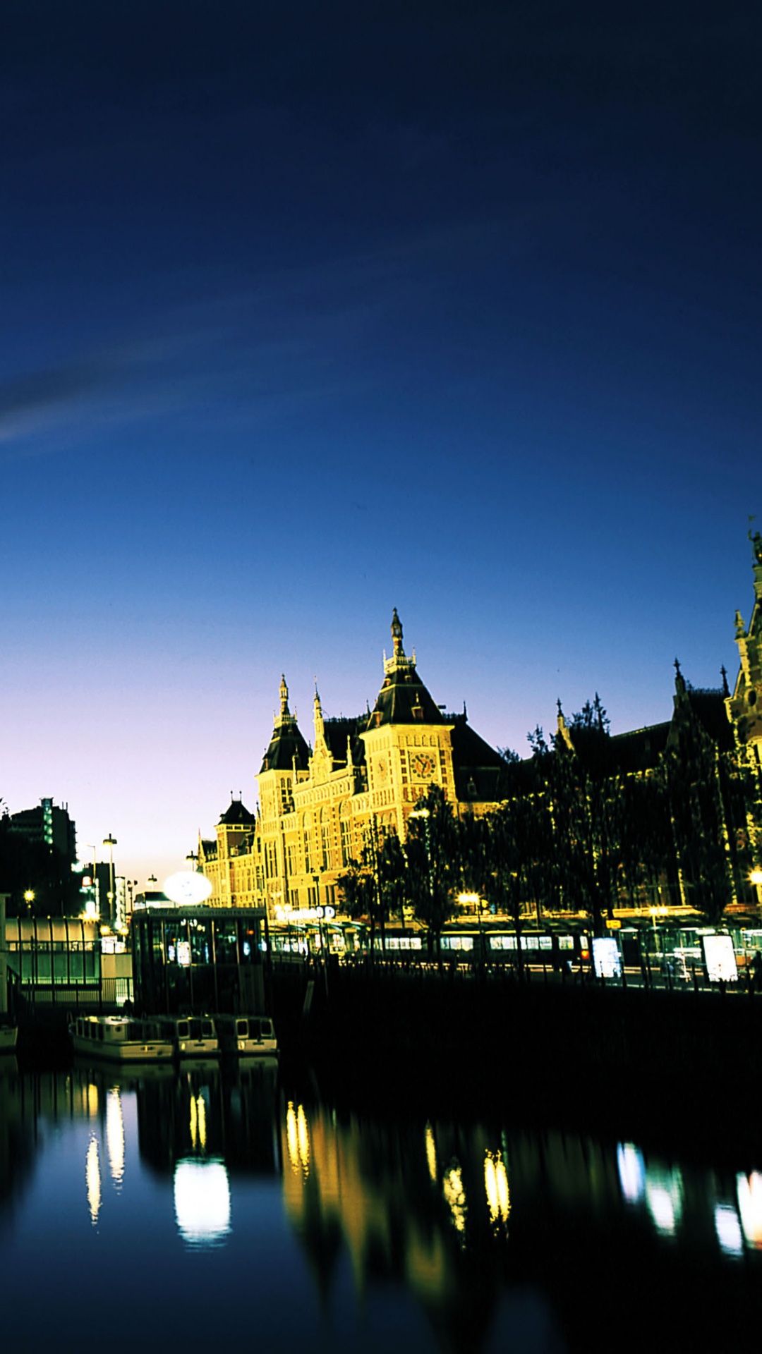 Body of Water Near Buildings During Night Time. Wallpaper in 1080x1920 Resolution
