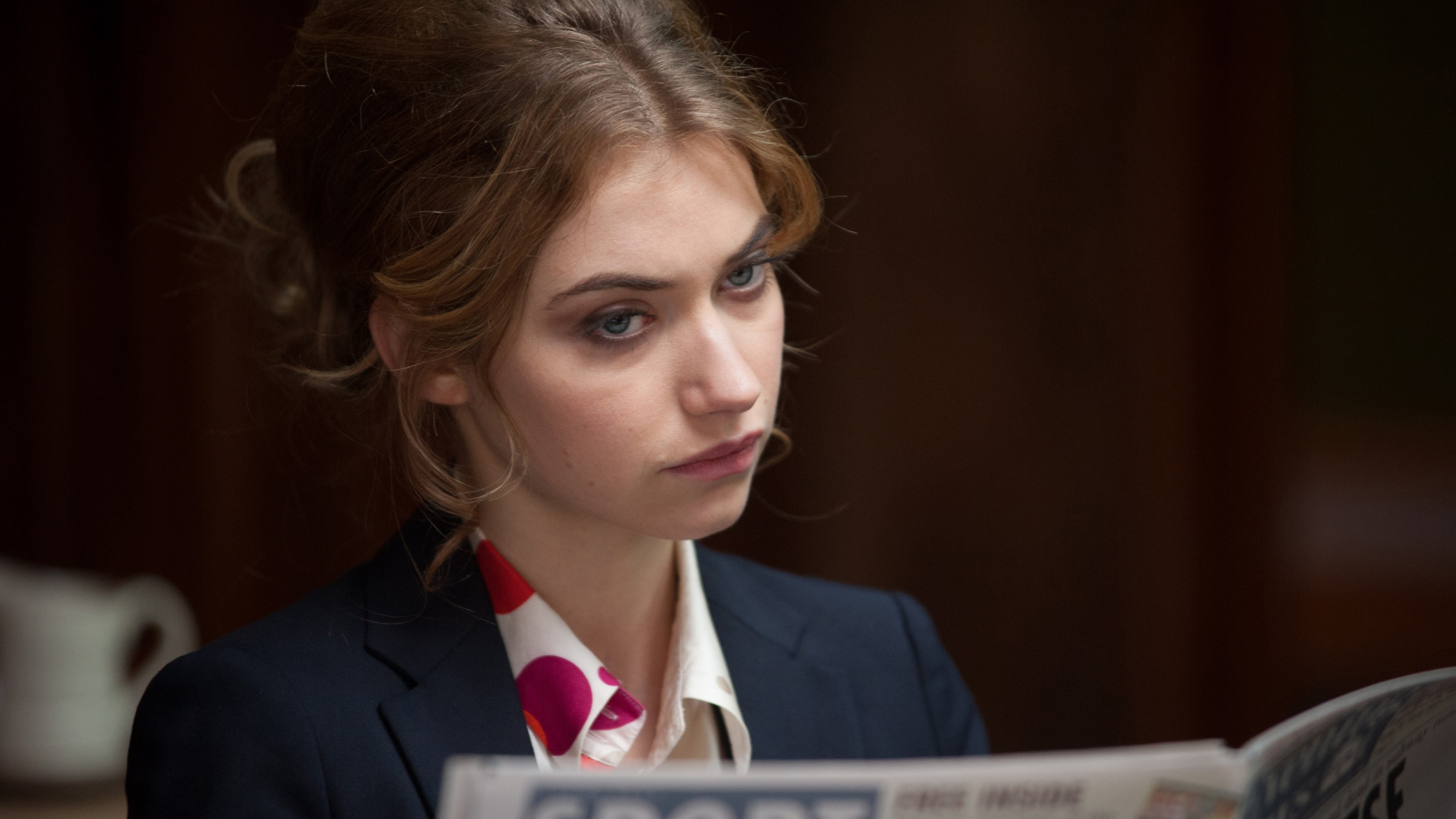 Woman in Black Suit Jacket Holding White and Blue Book. Wallpaper in 3840x2160 Resolution