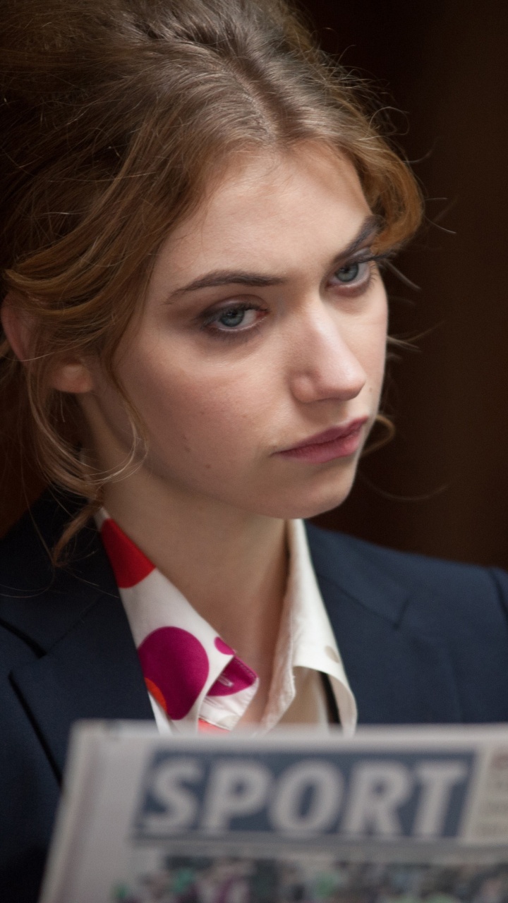 Woman in Black Suit Jacket Holding White and Blue Book. Wallpaper in 720x1280 Resolution