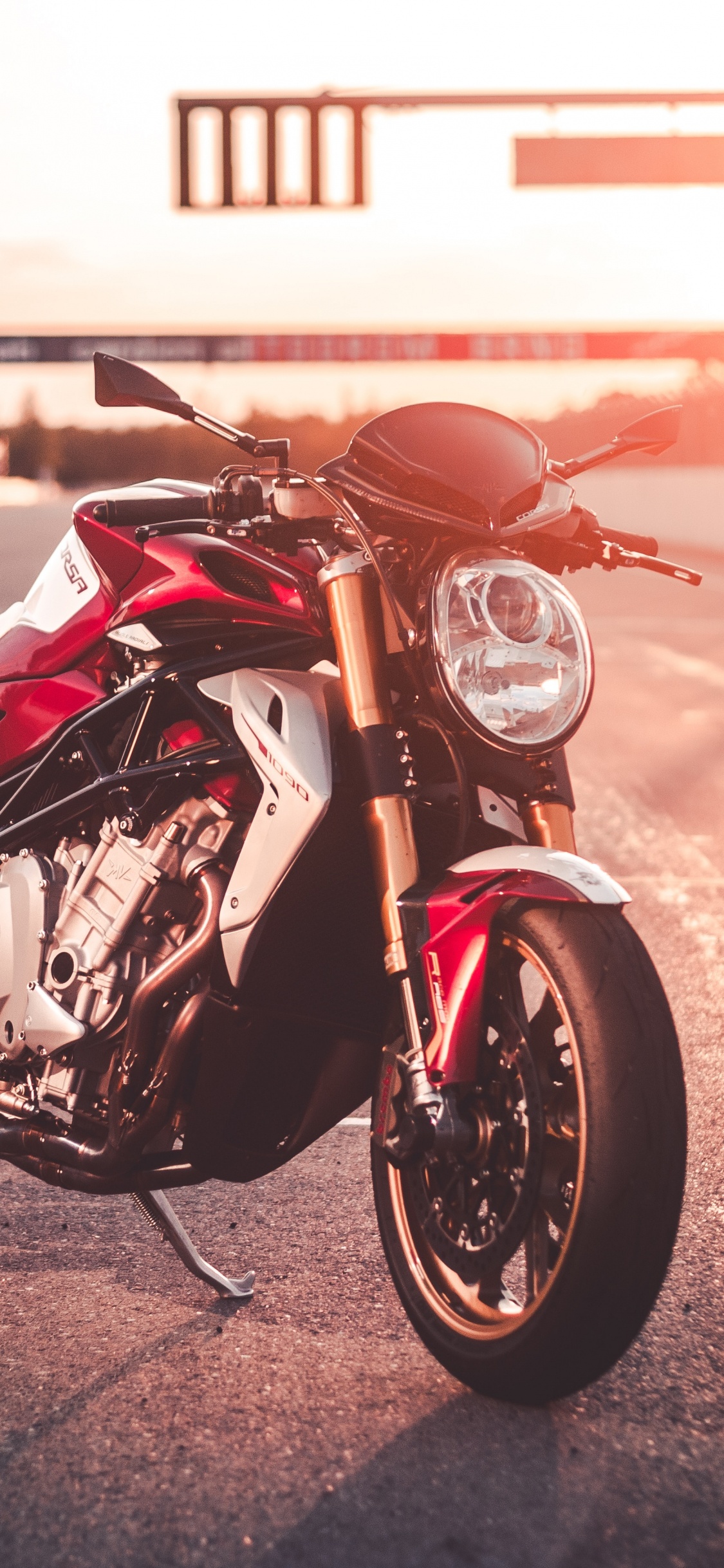 Red and Black Sports Bike on Road During Daytime. Wallpaper in 1125x2436 Resolution