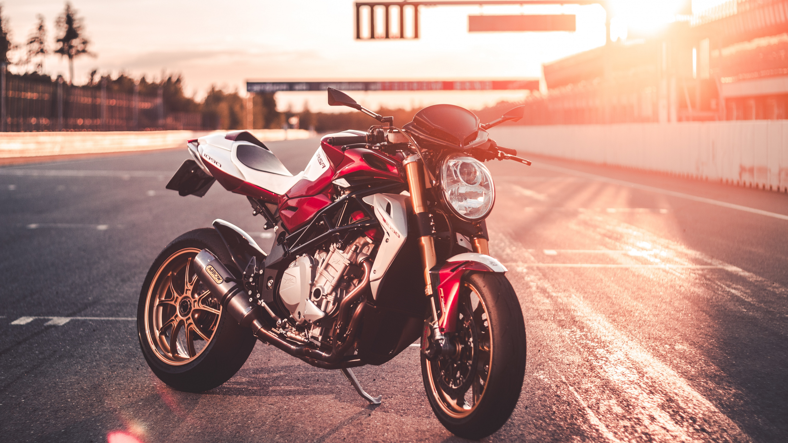 Red and Black Sports Bike on Road During Daytime. Wallpaper in 2560x1440 Resolution