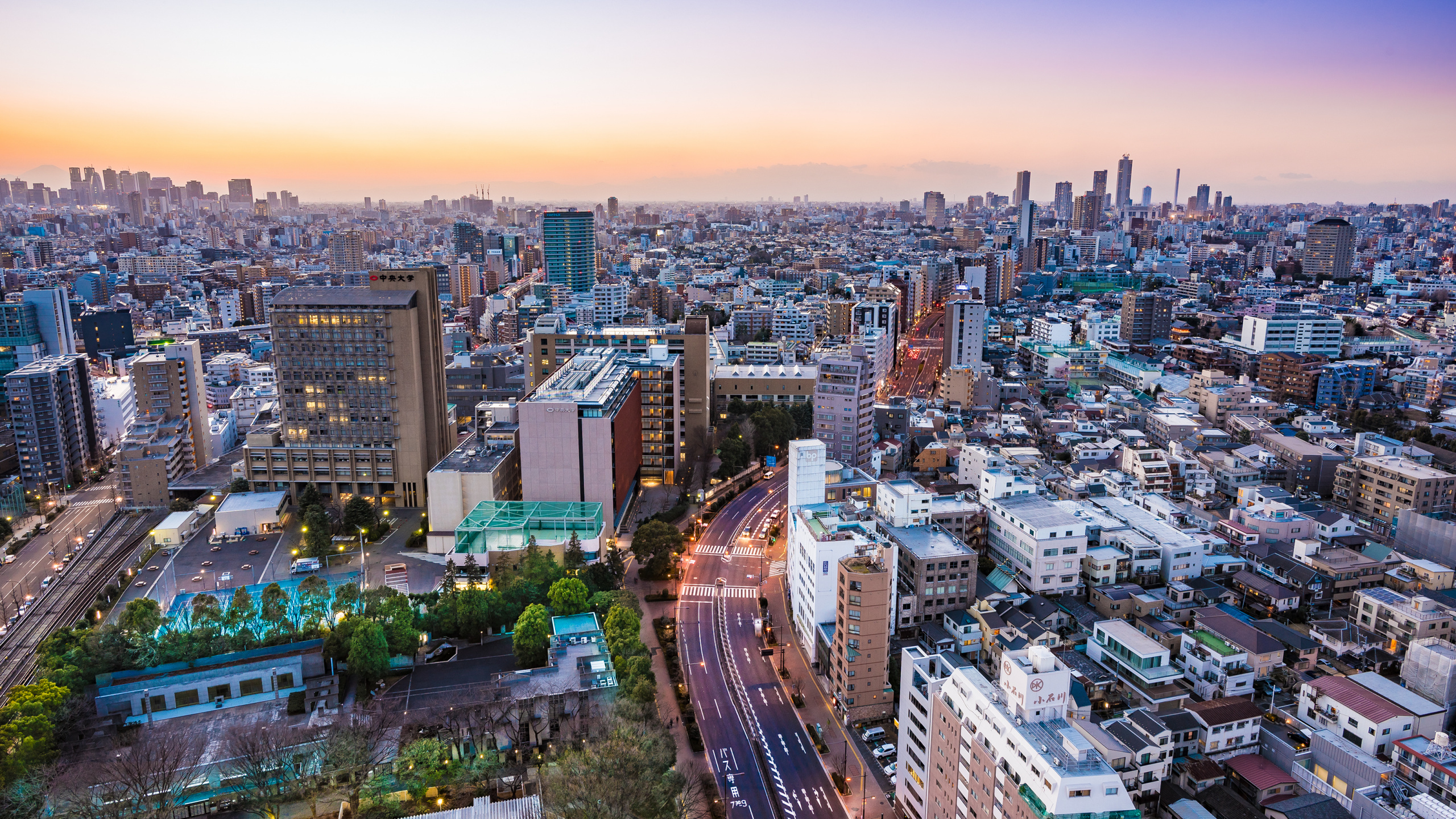 City With High Rise Buildings During Sunset. Wallpaper in 2560x1440 Resolution
