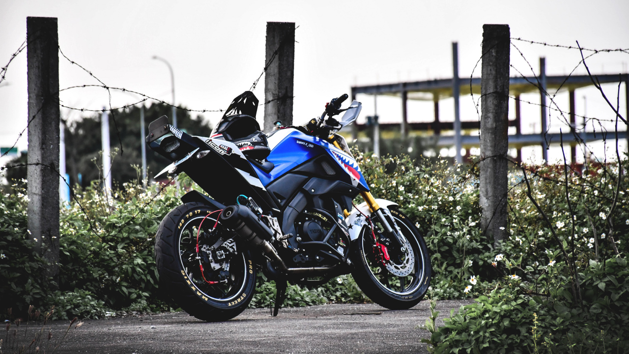 Black and Blue Sports Bike Parked on Gray Concrete Road During Daytime. Wallpaper in 1280x720 Resolution