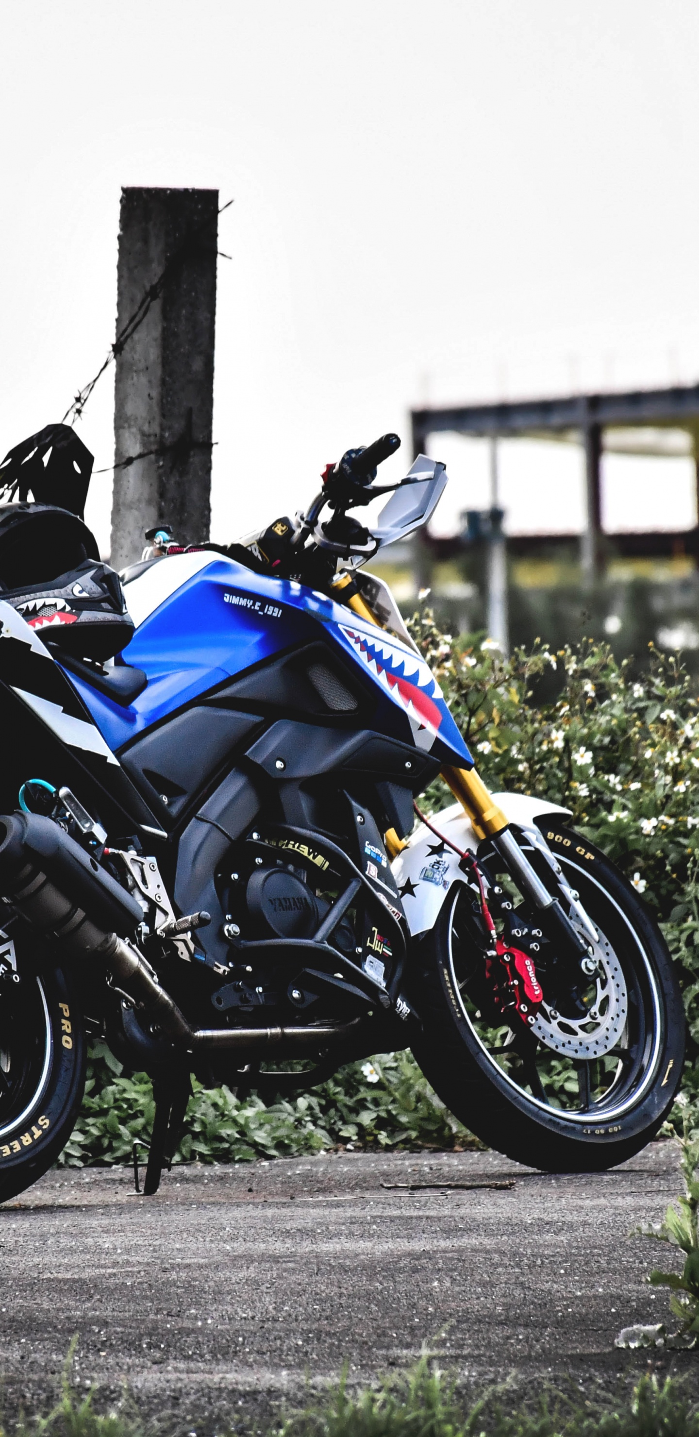 Black and Blue Sports Bike Parked on Gray Concrete Road During Daytime. Wallpaper in 1440x2960 Resolution