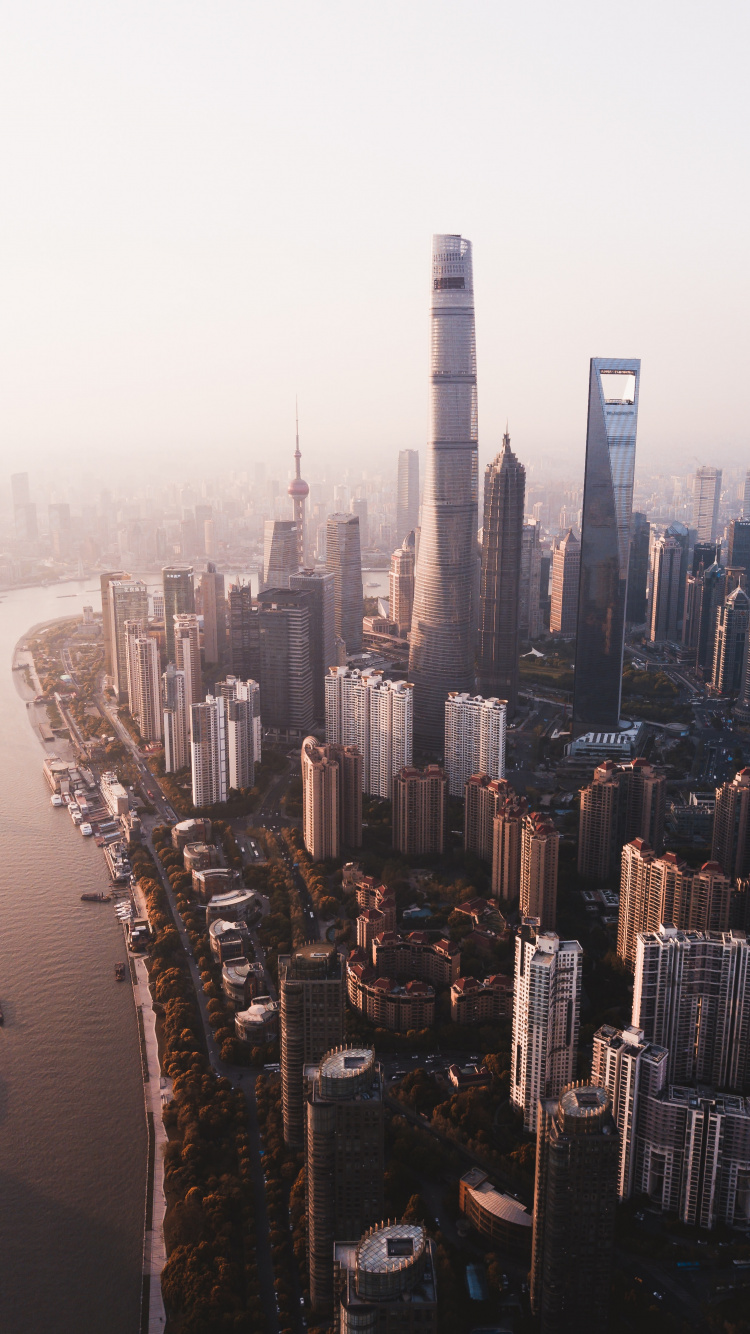 High Rise Buildings Near Body of Water During Daytime. Wallpaper in 750x1334 Resolution