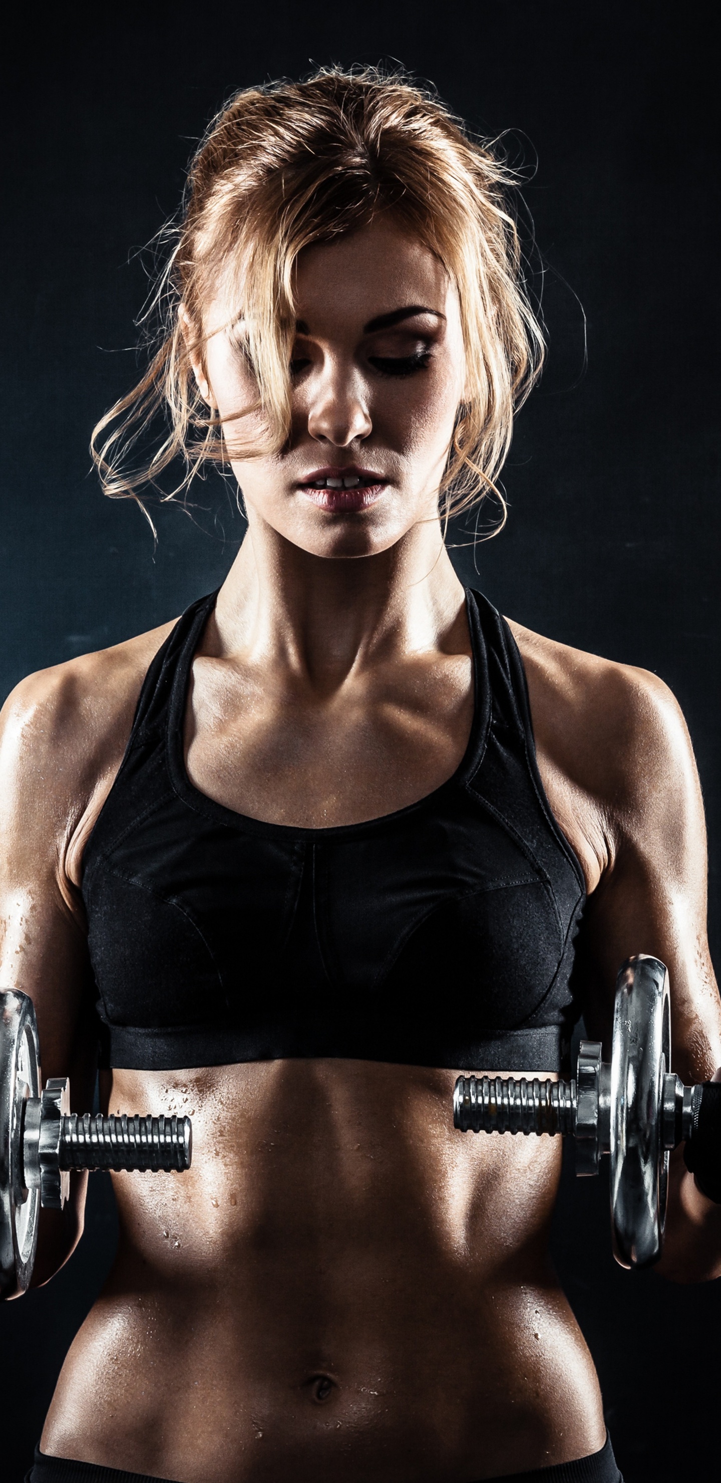 Woman in Black Tank Top Holding Dumbbell. Wallpaper in 1440x2960 Resolution