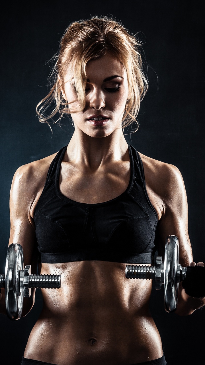 Woman in Black Tank Top Holding Dumbbell. Wallpaper in 720x1280 Resolution