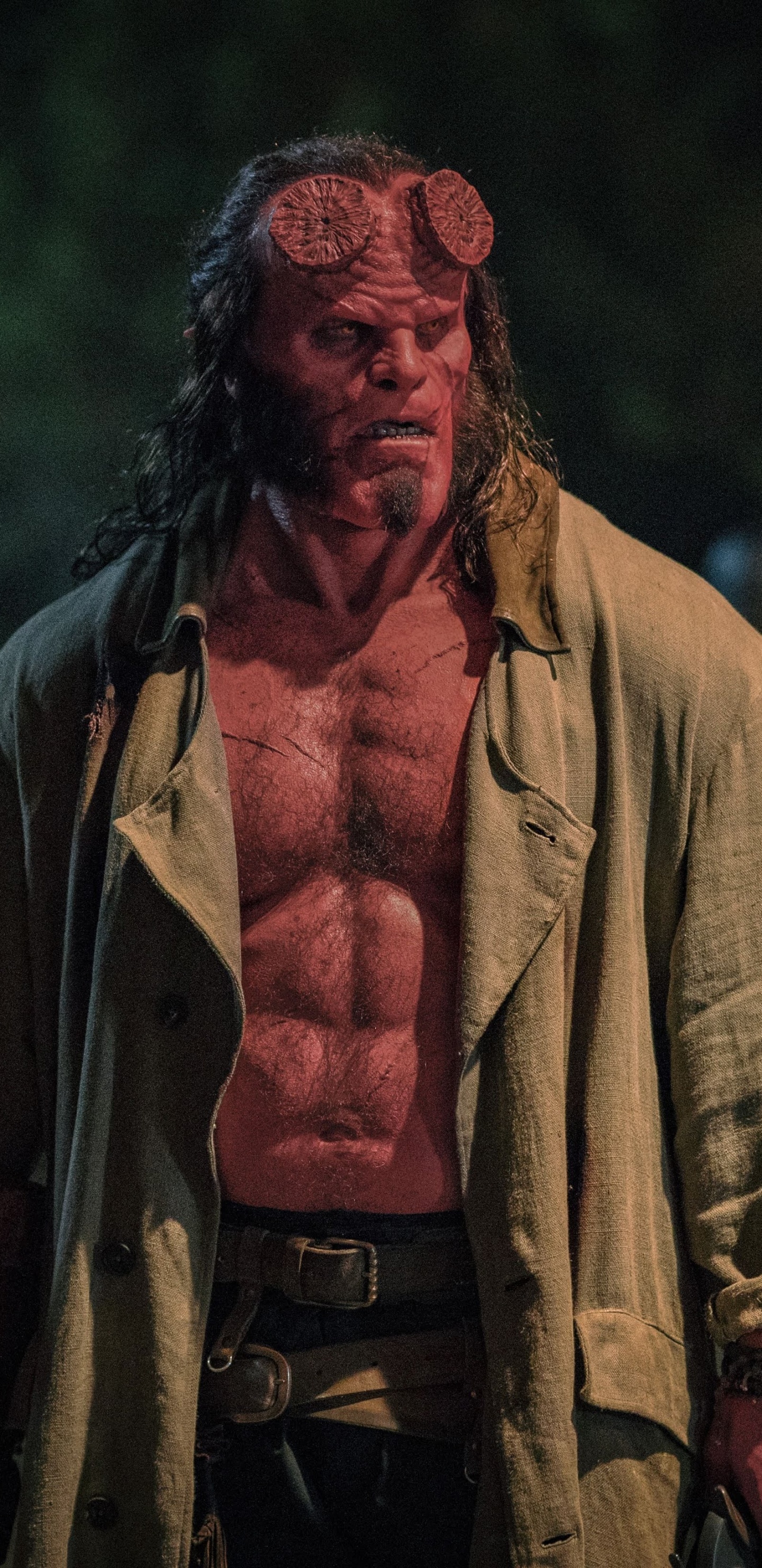 Man in Brown Coat Standing on Green Grass Field During Daytime. Wallpaper in 1440x2960 Resolution