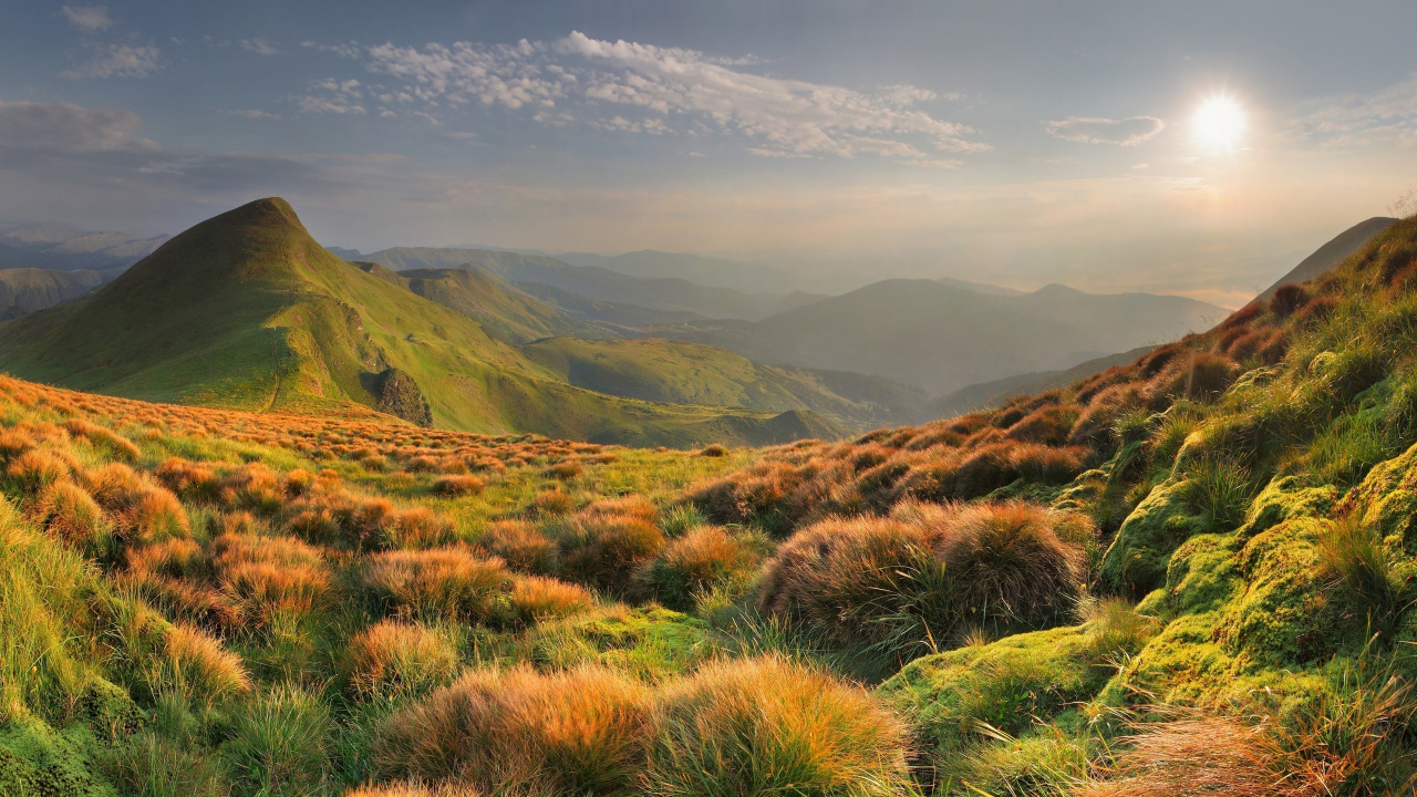 Green Grass Field Near Mountains During Daytime. Wallpaper in 1280x720 Resolution