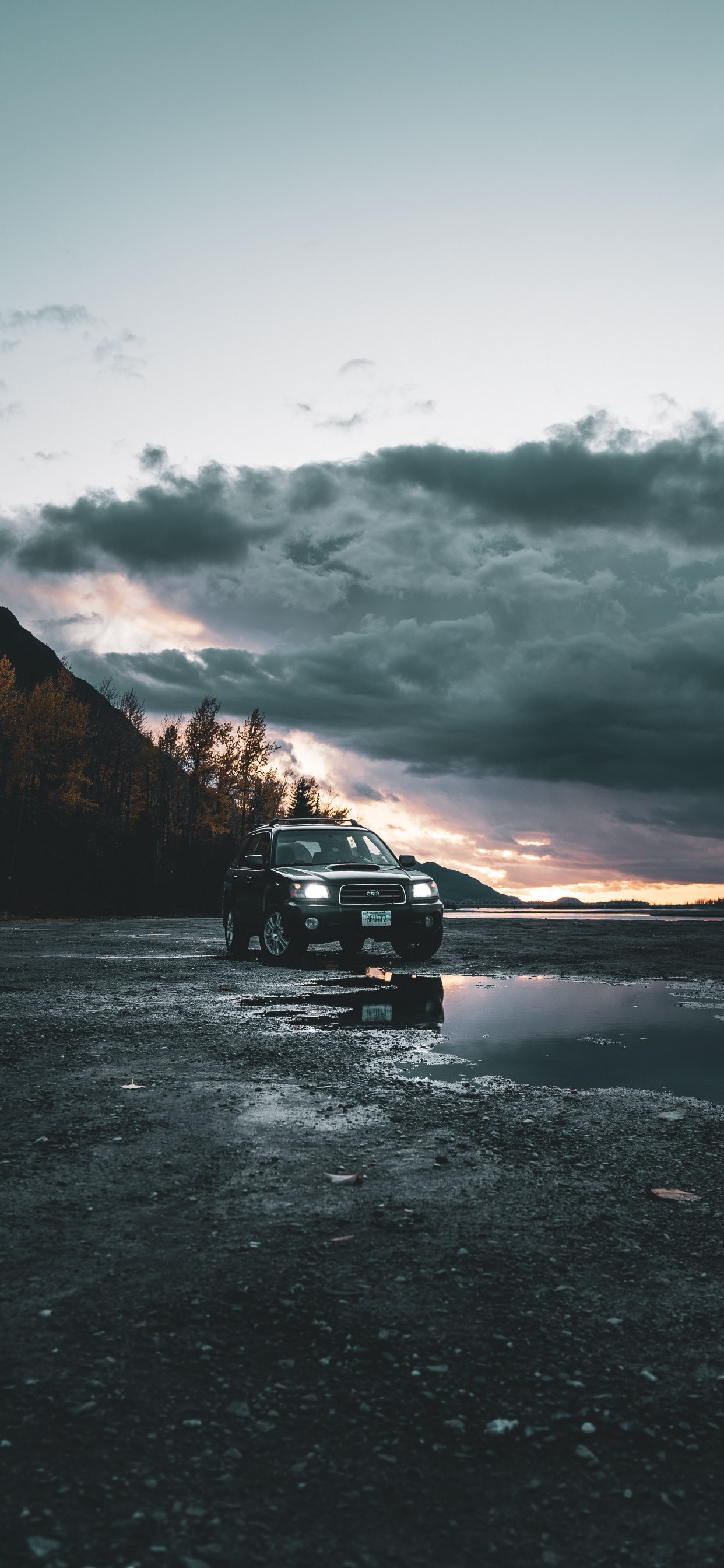 Black Suv on Road Near Mountain During Daytime. Wallpaper in 1242x2688 Resolution