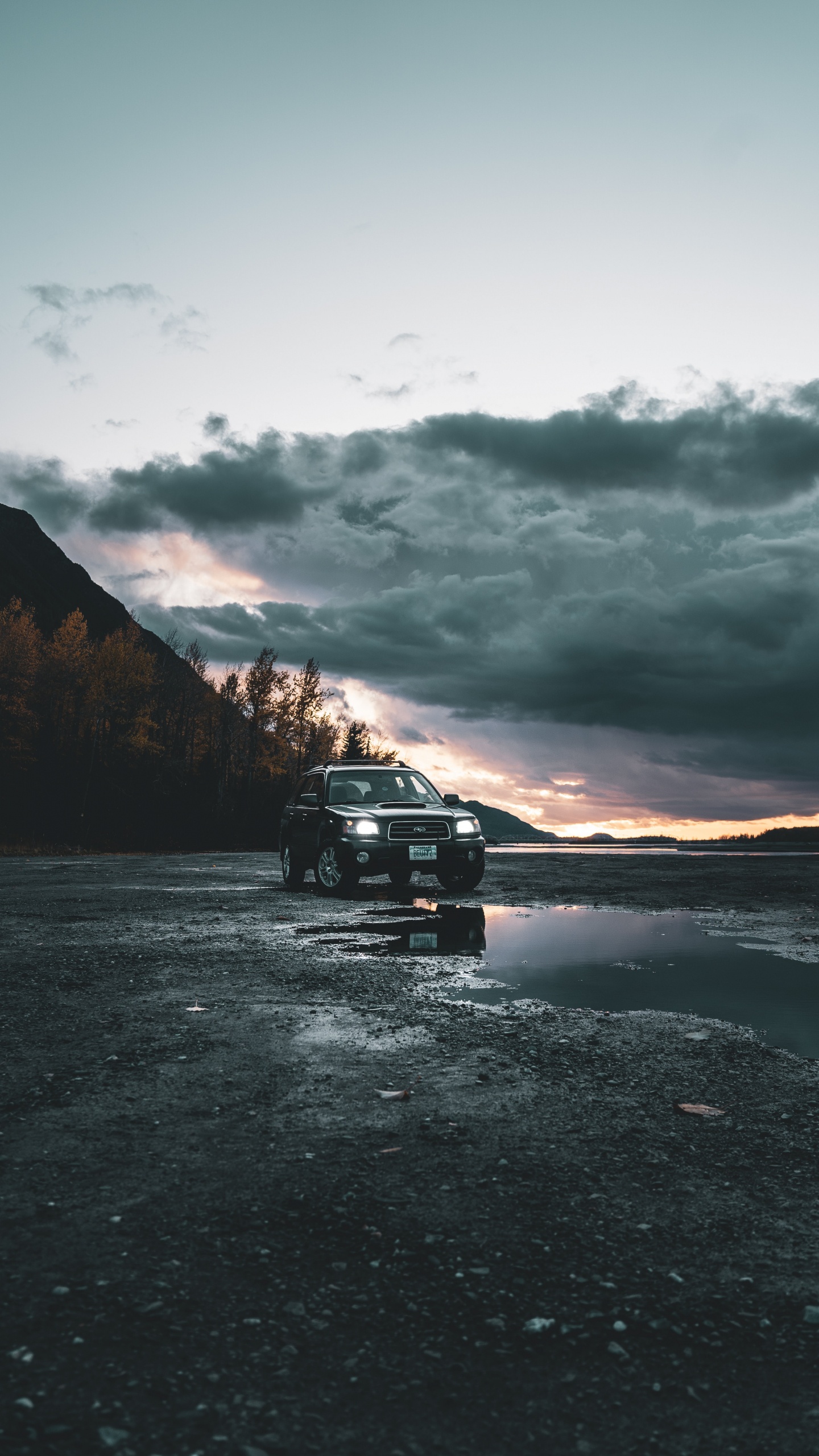 Black Suv on Road Near Mountain During Daytime. Wallpaper in 1440x2560 Resolution