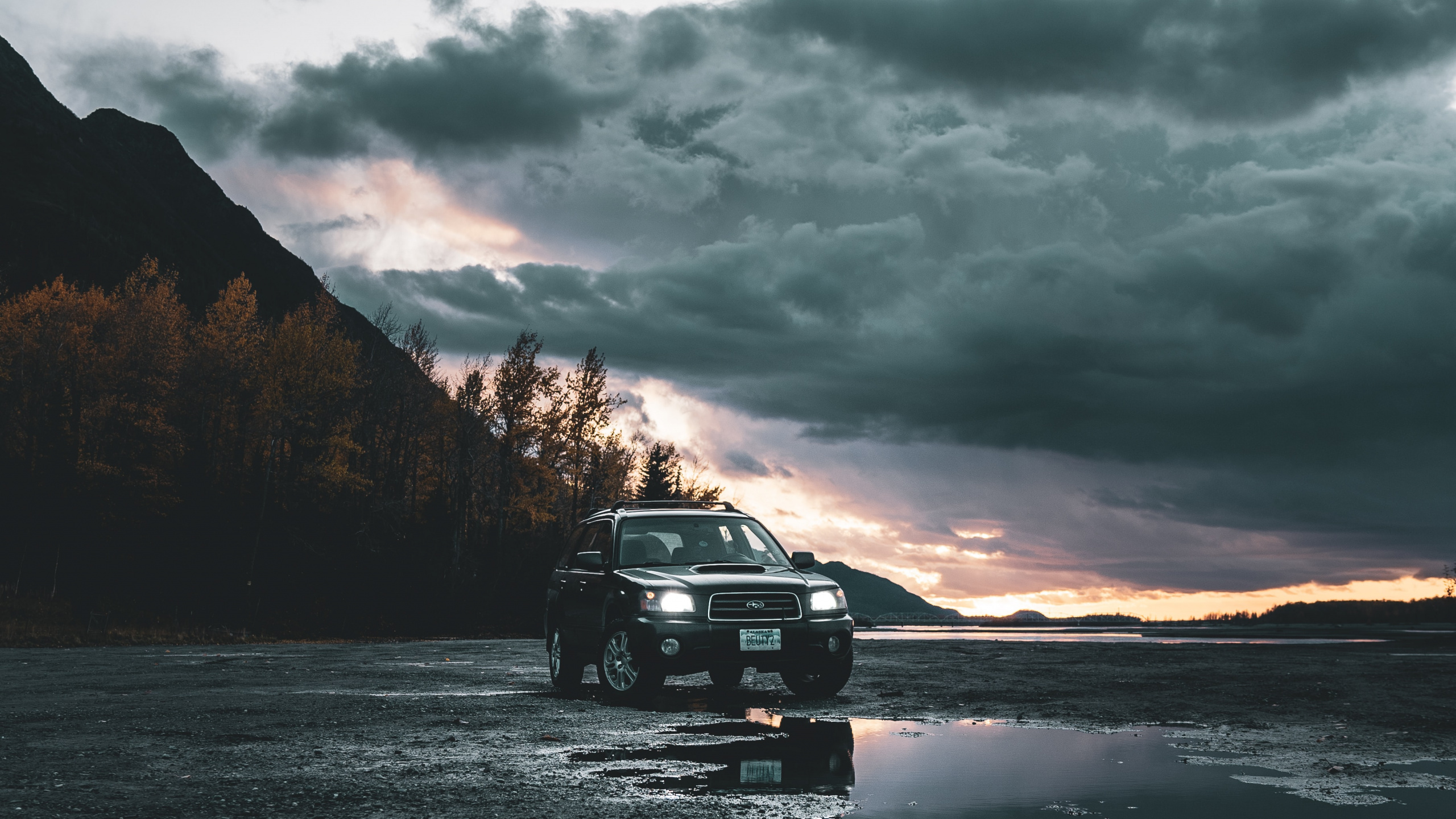 Black Suv on Road Near Mountain During Daytime. Wallpaper in 2560x1440 Resolution
