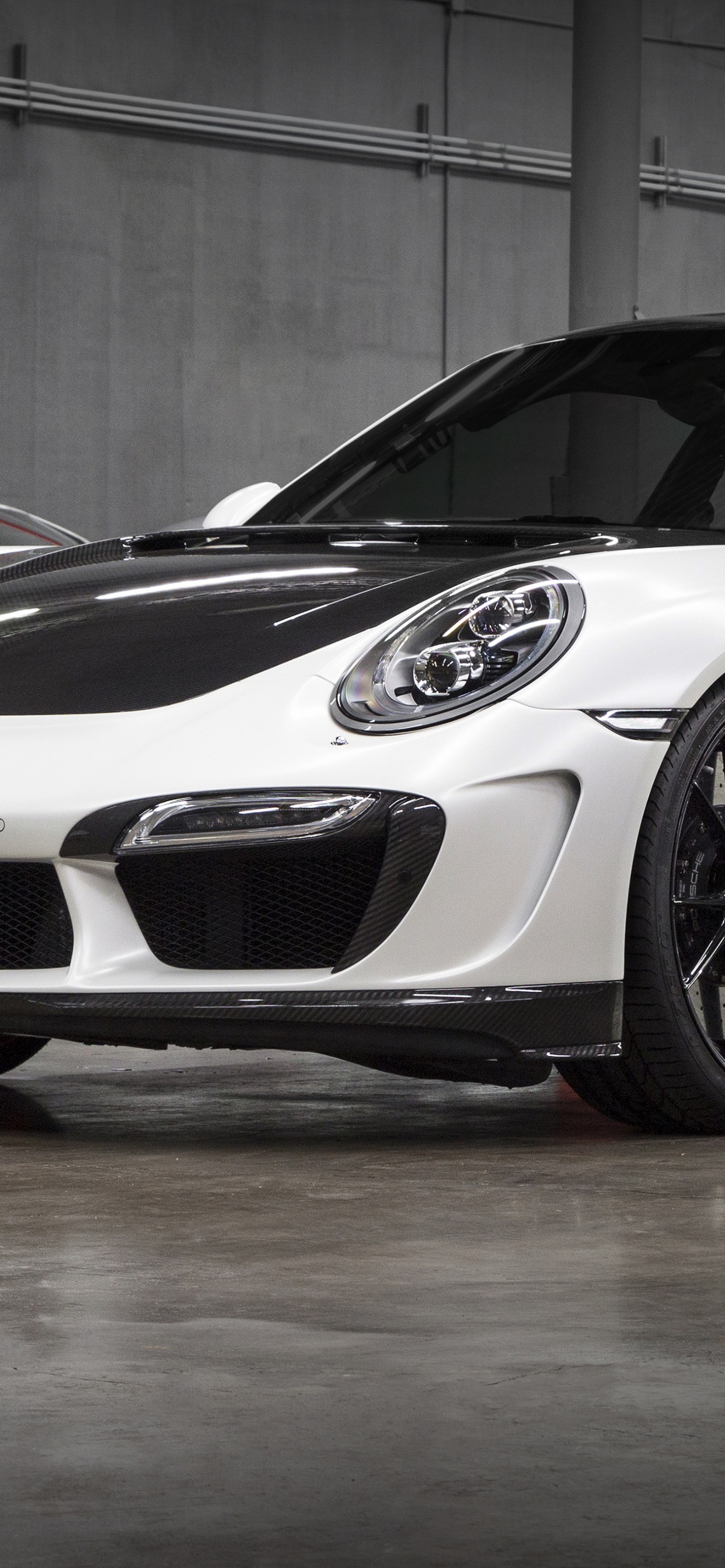 White Porsche 911 Parked in Garage. Wallpaper in 1242x2688 Resolution