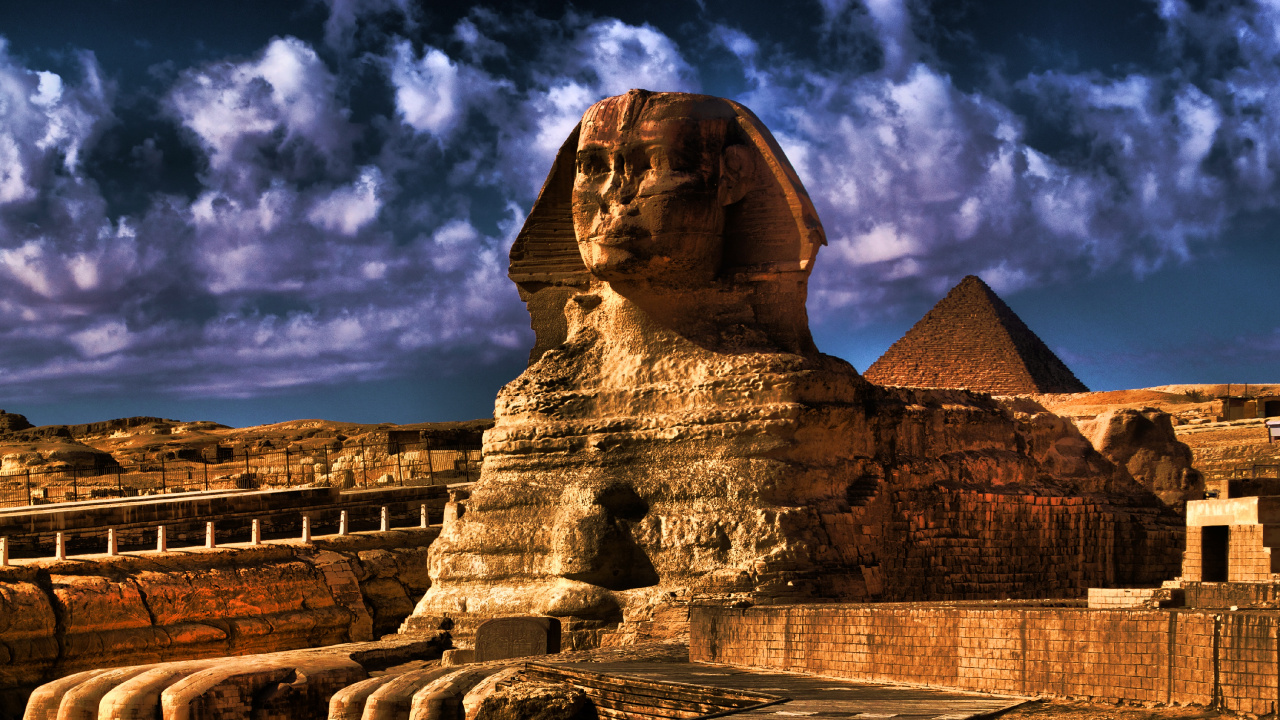 Brown Concrete Statue Under Cloudy Sky During Daytime. Wallpaper in 1280x720 Resolution