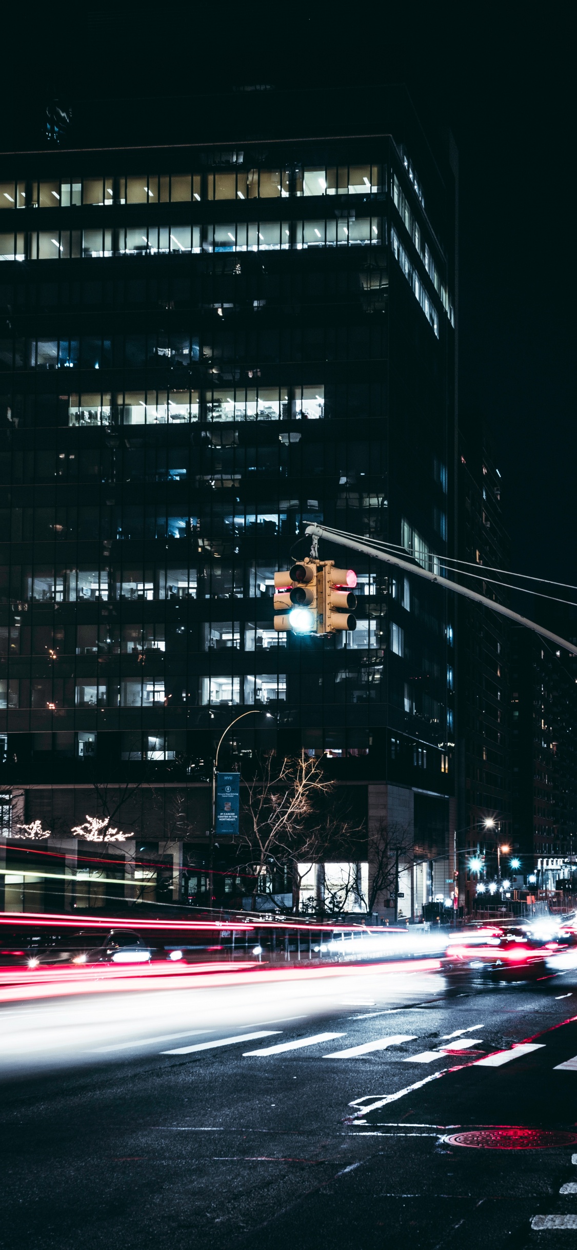 Time Lapse Photography of Cars on Road During Night Time. Wallpaper in 1125x2436 Resolution