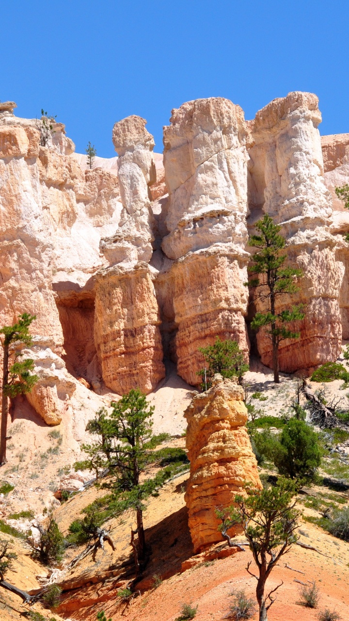 Brown Rocky Mountain Under Blue Sky During Daytime. Wallpaper in 720x1280 Resolution