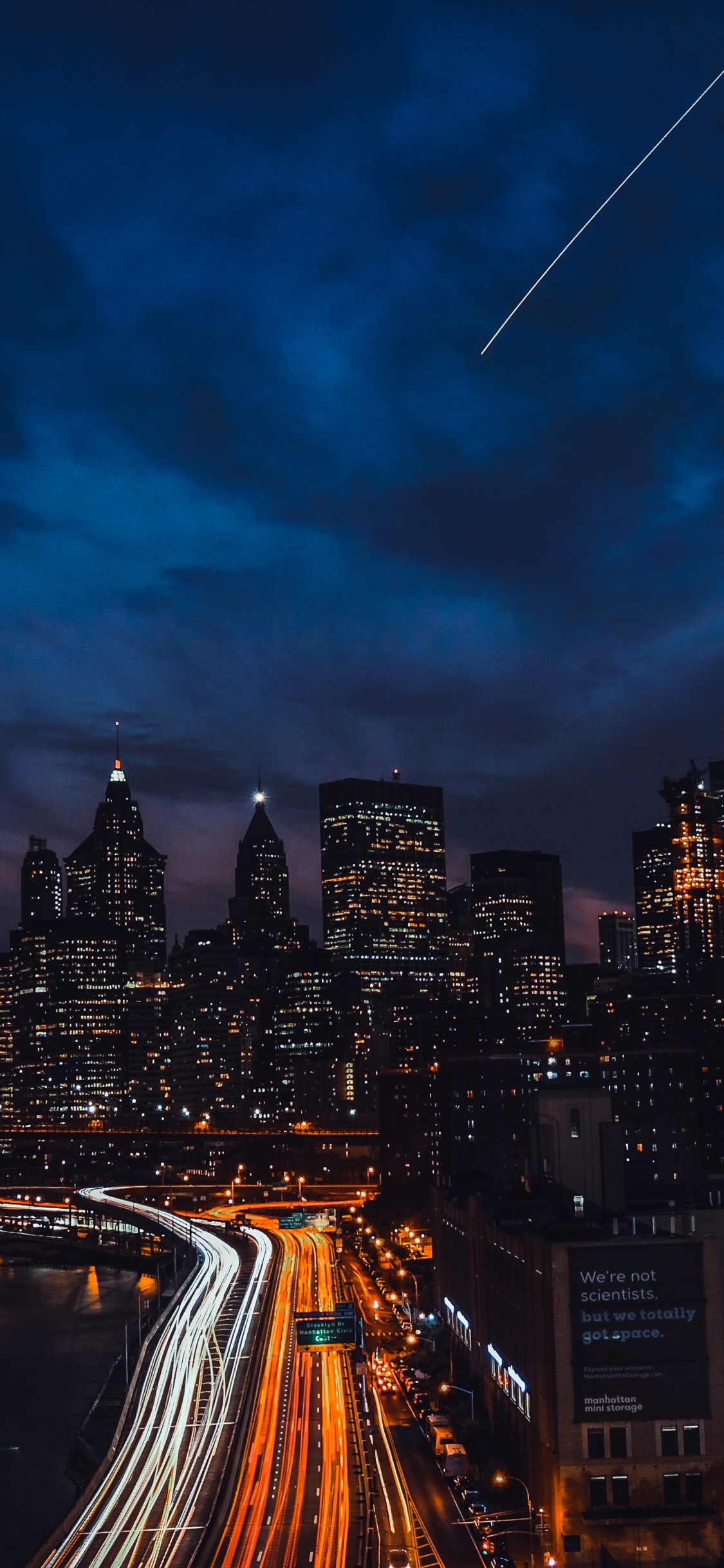 Photographie en Accéléré Des Toits de la Ville Pendant la Nuit. Wallpaper in 1125x2436 Resolution