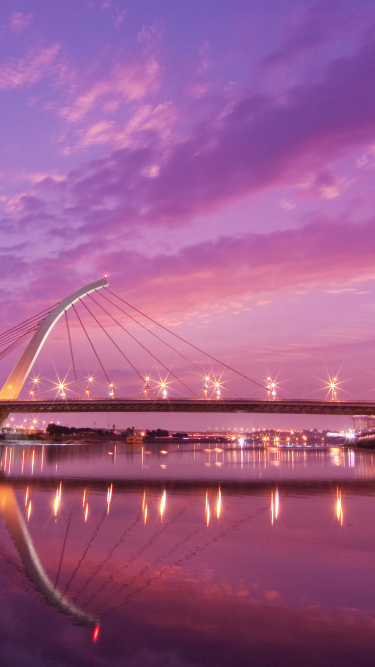 Bridge Over Water During Night Time. Wallpaper in 750x1334 Resolution