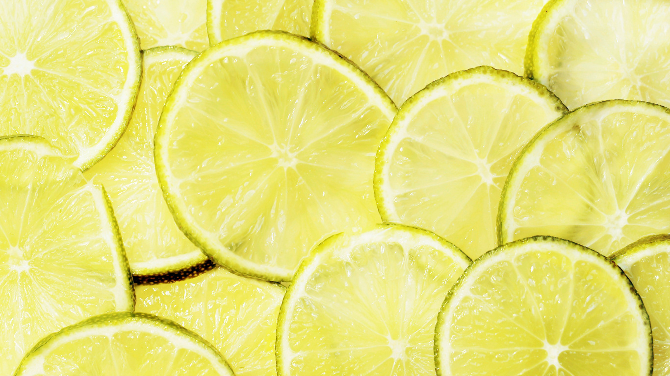 Gelbe Zitronenfrucht Mit Wassertropfen. Wallpaper in 1366x768 Resolution