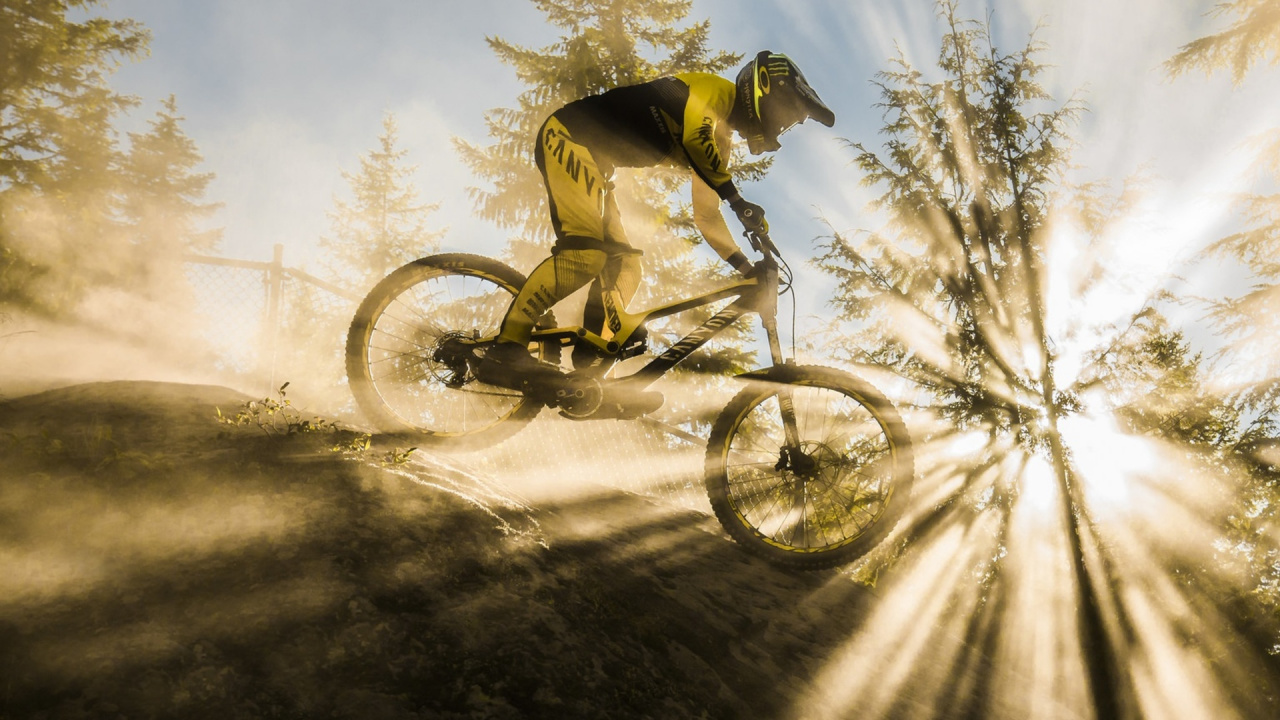 Man in Yellow Jacket Riding on Green Mountain Bike During Daytime. Wallpaper in 1280x720 Resolution