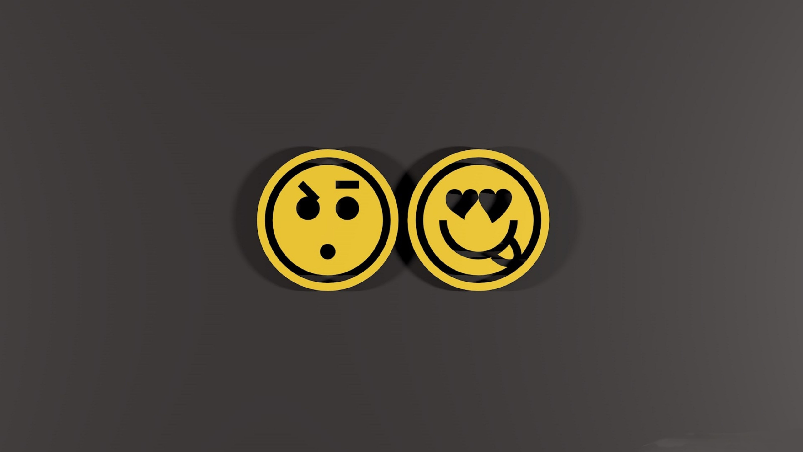 Yellow and Black Smiley Emoji. Wallpaper in 2560x1440 Resolution