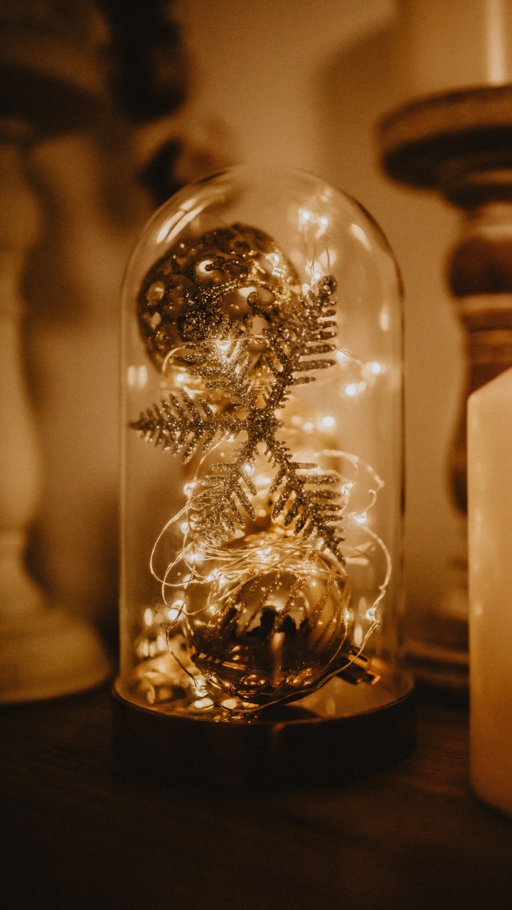 Clear Glass Ball on Brown Wooden Table. Wallpaper in 720x1280 Resolution