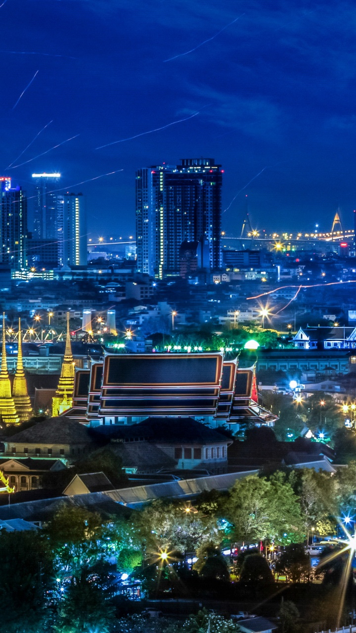 City With High Rise Buildings During Night Time. Wallpaper in 720x1280 Resolution