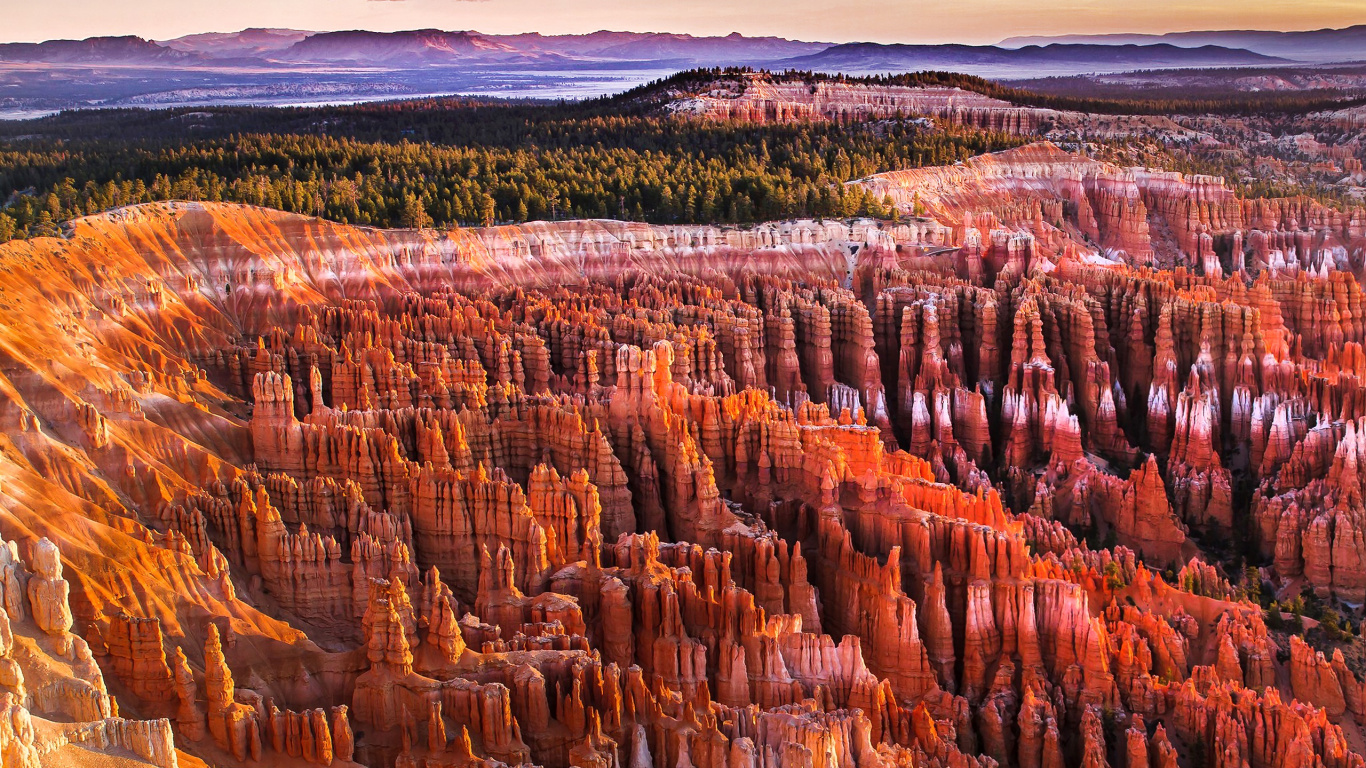 Brown Rock Formation Near Green Trees During Daytime. Wallpaper in 1366x768 Resolution