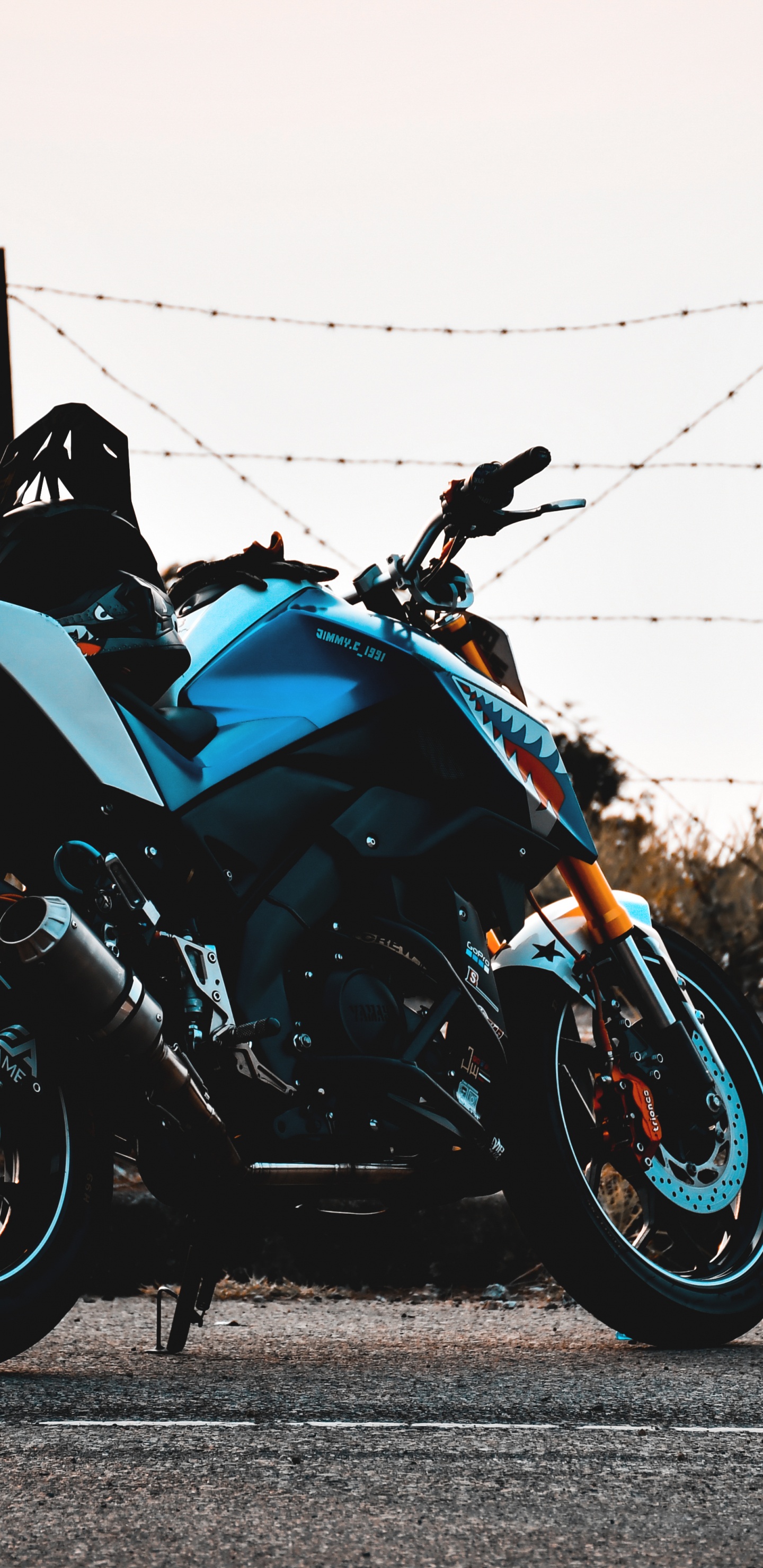 Black and Blue Sports Bike Parked on Gray Concrete Road During Daytime. Wallpaper in 1440x2960 Resolution