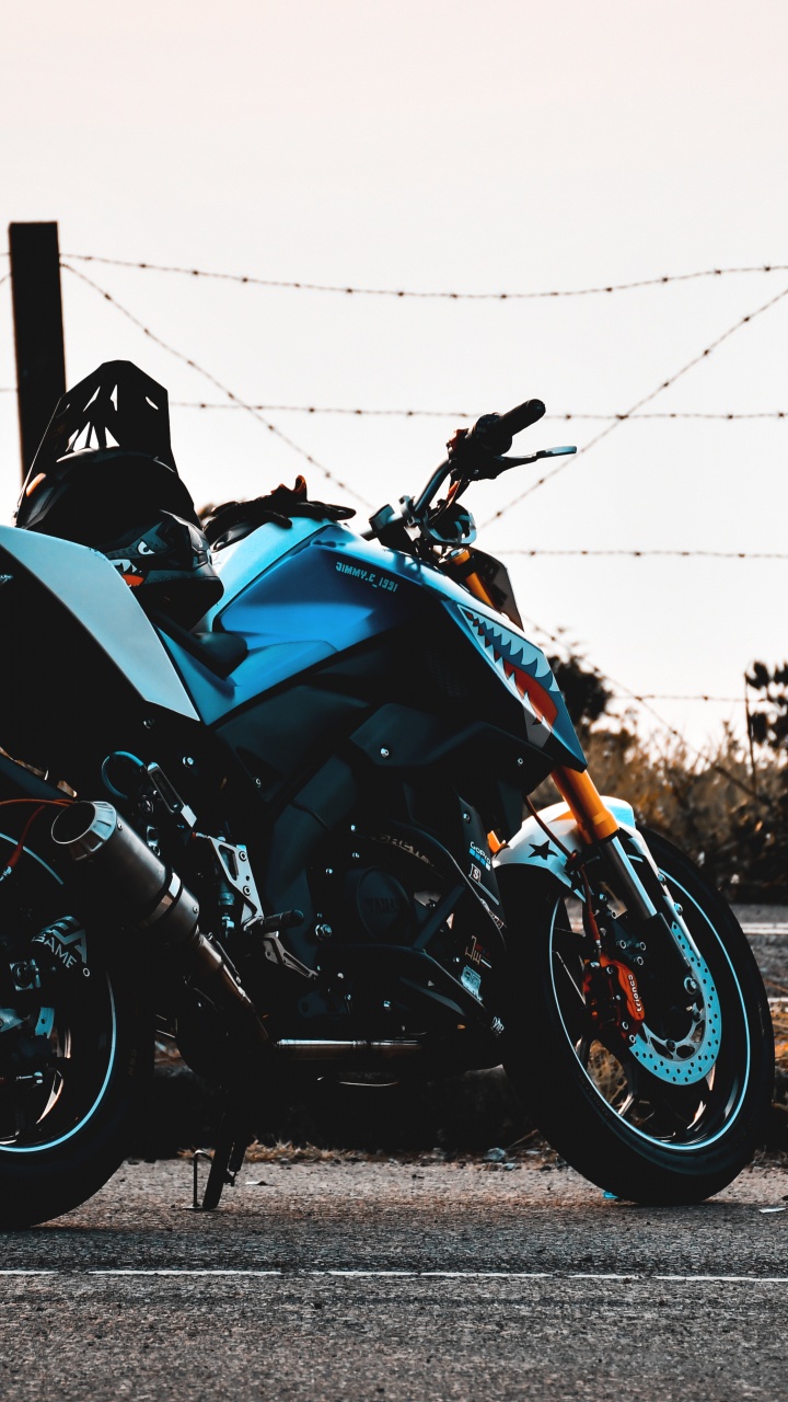 Black and Blue Sports Bike Parked on Gray Concrete Road During Daytime. Wallpaper in 720x1280 Resolution