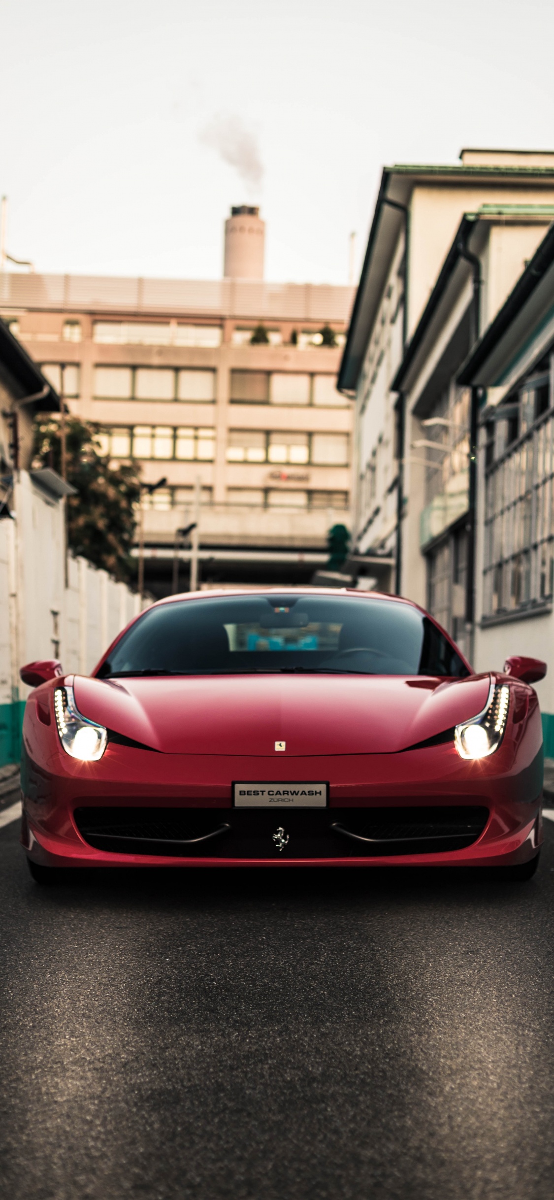 Ferrari 458 Italia Rojo Estacionado en la Acera Durante el Día. Wallpaper in 1125x2436 Resolution