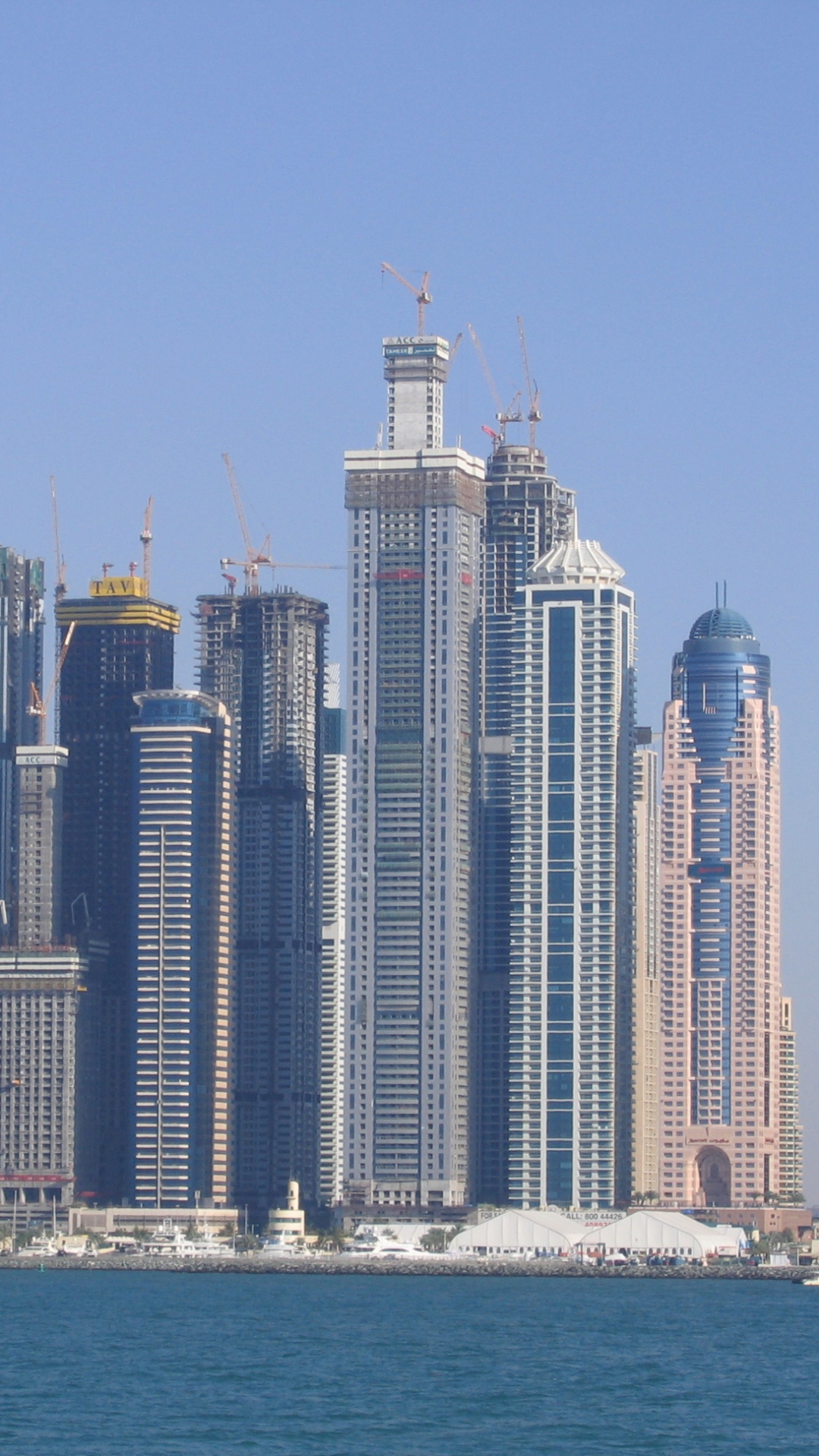 City Skyline Across Body of Water During Daytime. Wallpaper in 1080x1920 Resolution