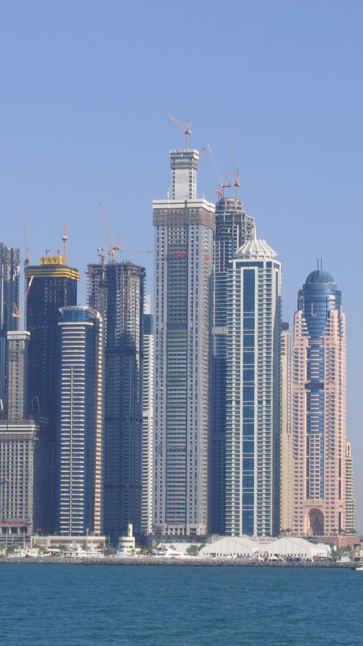 City Skyline Across Body of Water During Daytime. Wallpaper in 720x1280 Resolution