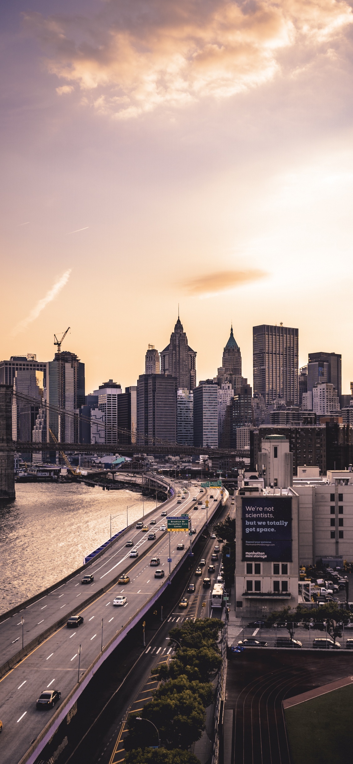 City Skyline Near Body of Water During Daytime. Wallpaper in 1125x2436 Resolution