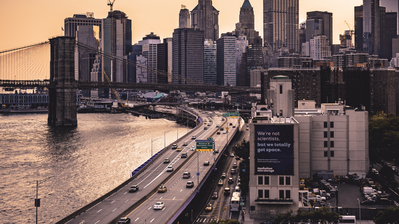 City Skyline Near Body of Water During Daytime. Wallpaper in 1366x768 Resolution