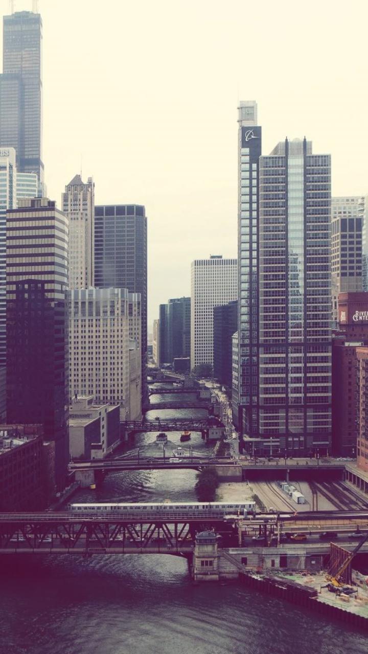 City Buildings Near Body of Water During Daytime. Wallpaper in 720x1280 Resolution