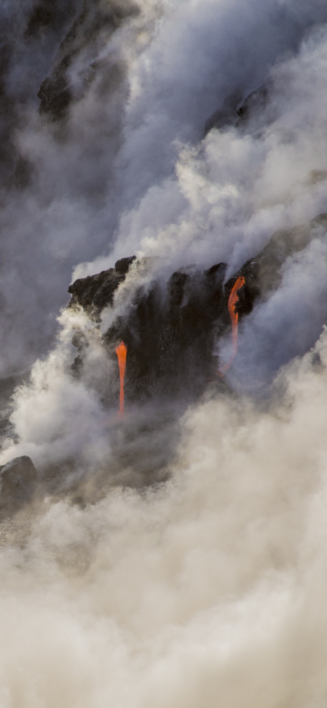 White Clouds Over Body of Water. Wallpaper in 1125x2436 Resolution