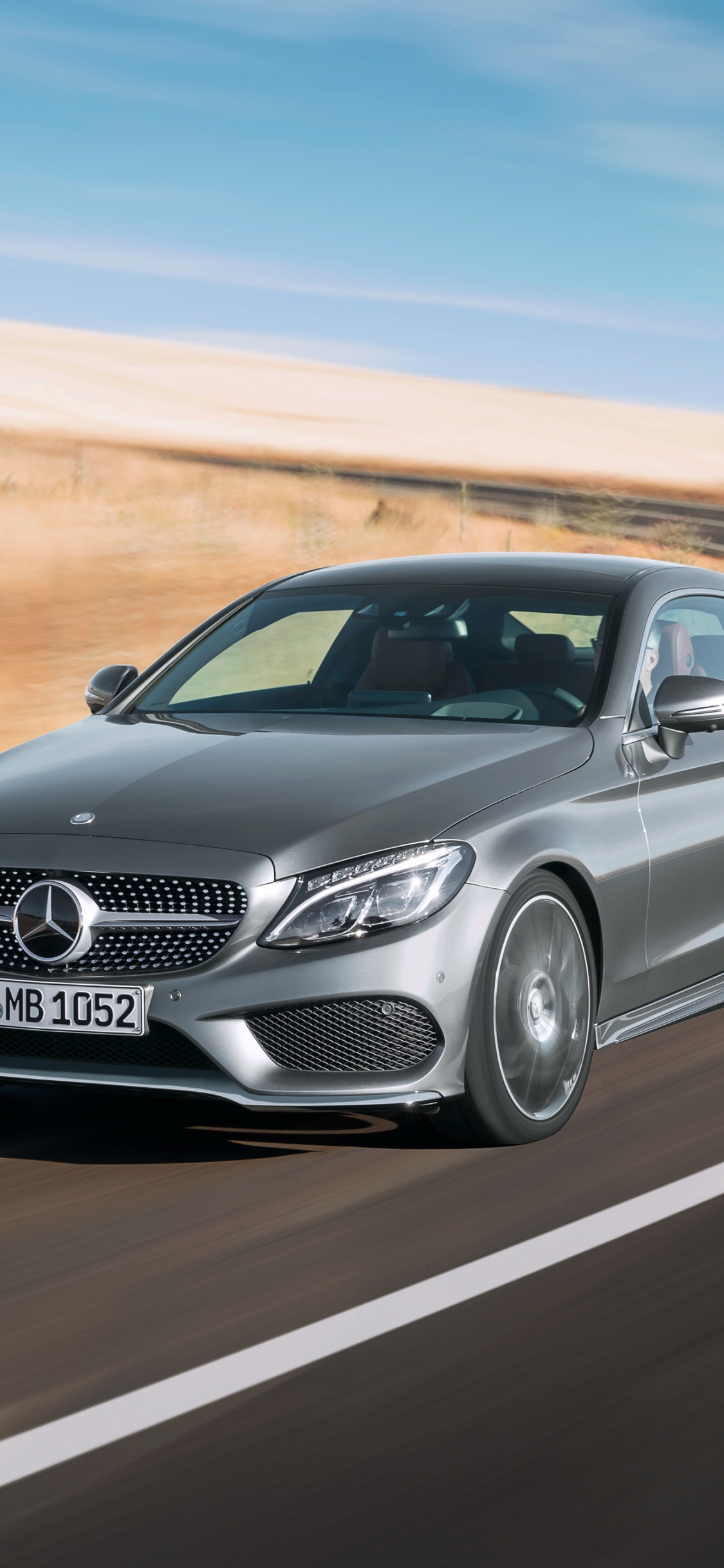 Black Mercedes Benz Coupe on Road During Daytime. Wallpaper in 1125x2436 Resolution