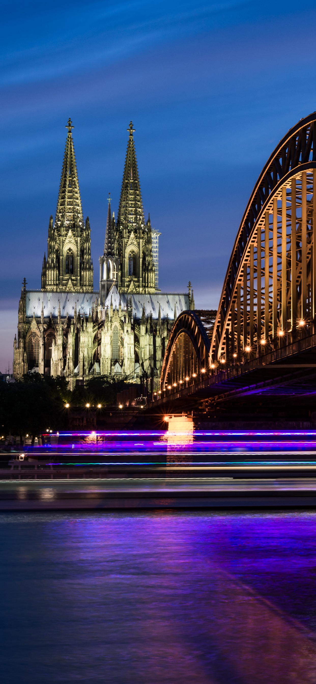 Bridge Over Body of Water During Night Time. Wallpaper in 1242x2688 Resolution