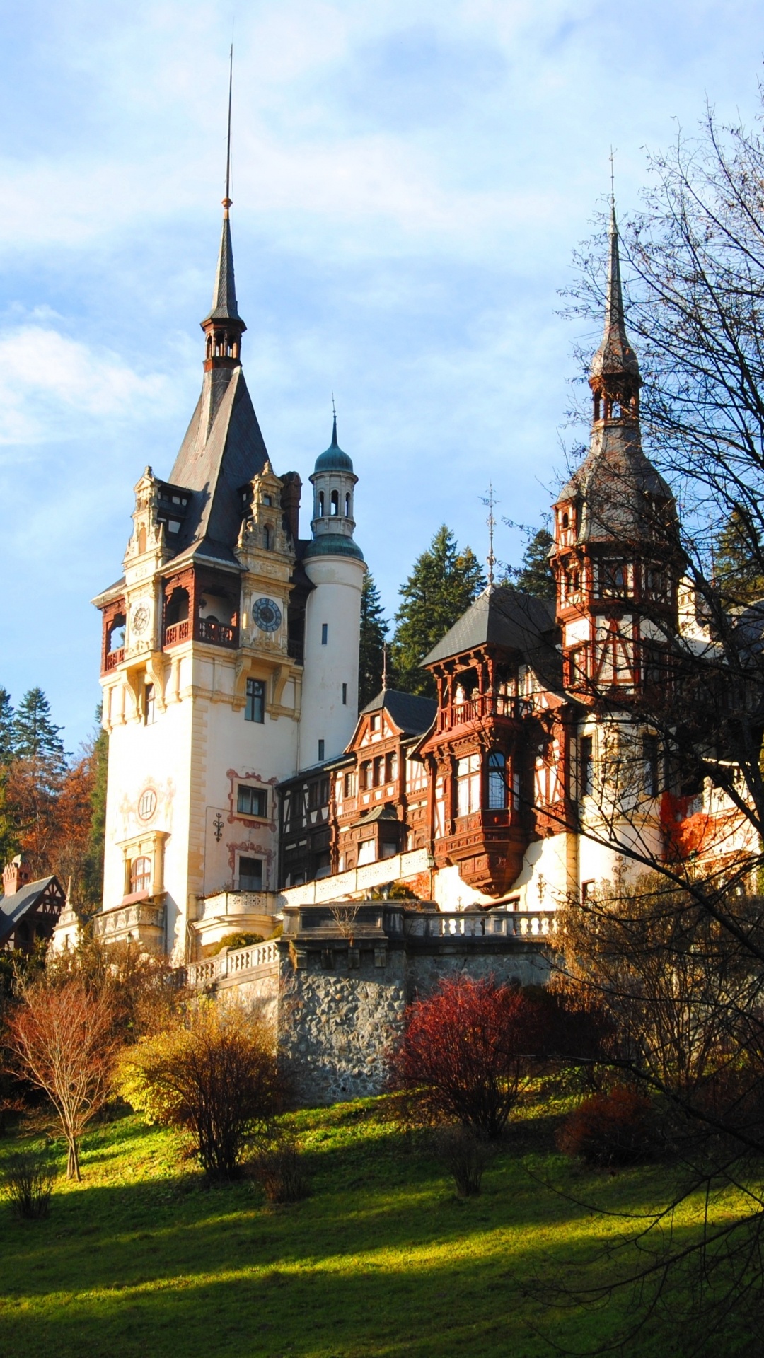 White and Brown Concrete Building Near Green Trees Under White Clouds and Blue Sky During Daytime. Wallpaper in 1080x1920 Resolution