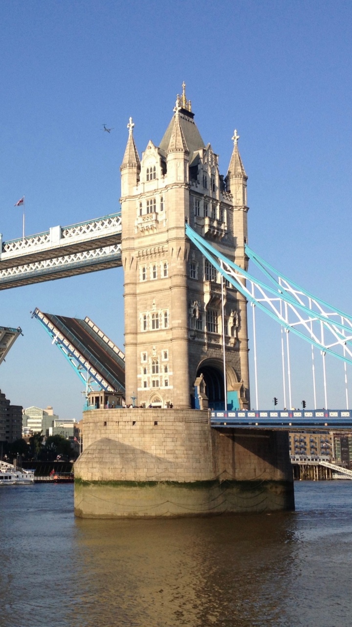 Brown Concrete Bridge Under Blue Sky During Daytime. Wallpaper in 720x1280 Resolution