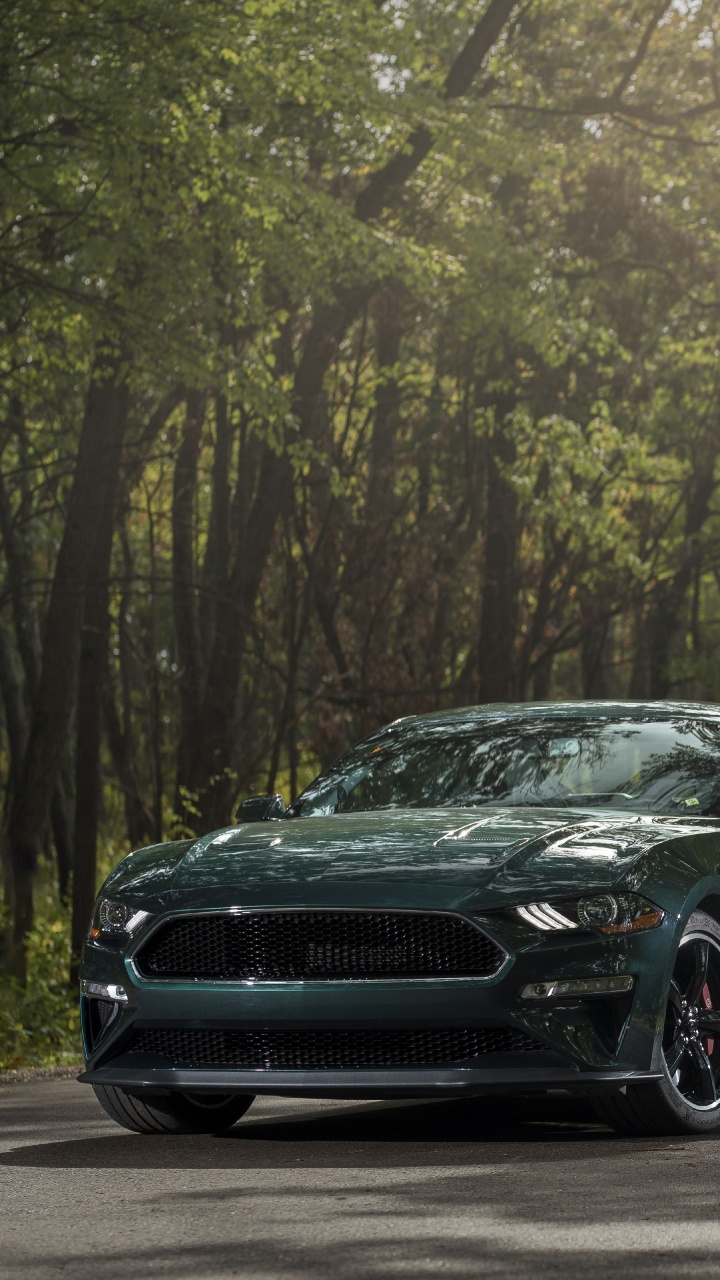 Black Sedan on Road in Between Trees During Daytime. Wallpaper in 720x1280 Resolution