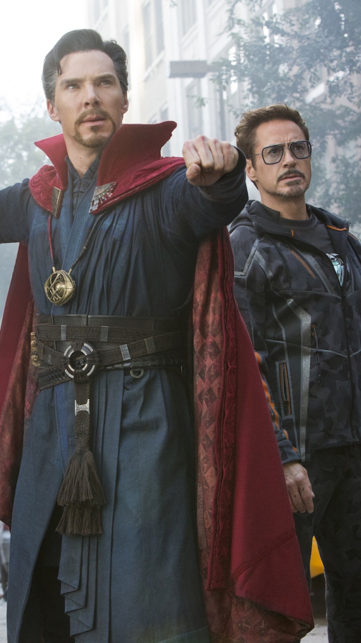 Man in Black Leather Jacket Standing Beside Man in Black Leather Jacket. Wallpaper in 720x1280 Resolution