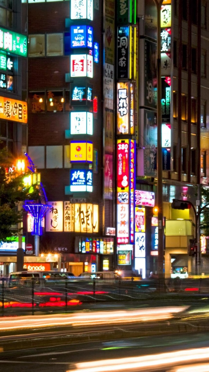 City Buildings With Lights Turned on During Night Time. Wallpaper in 720x1280 Resolution