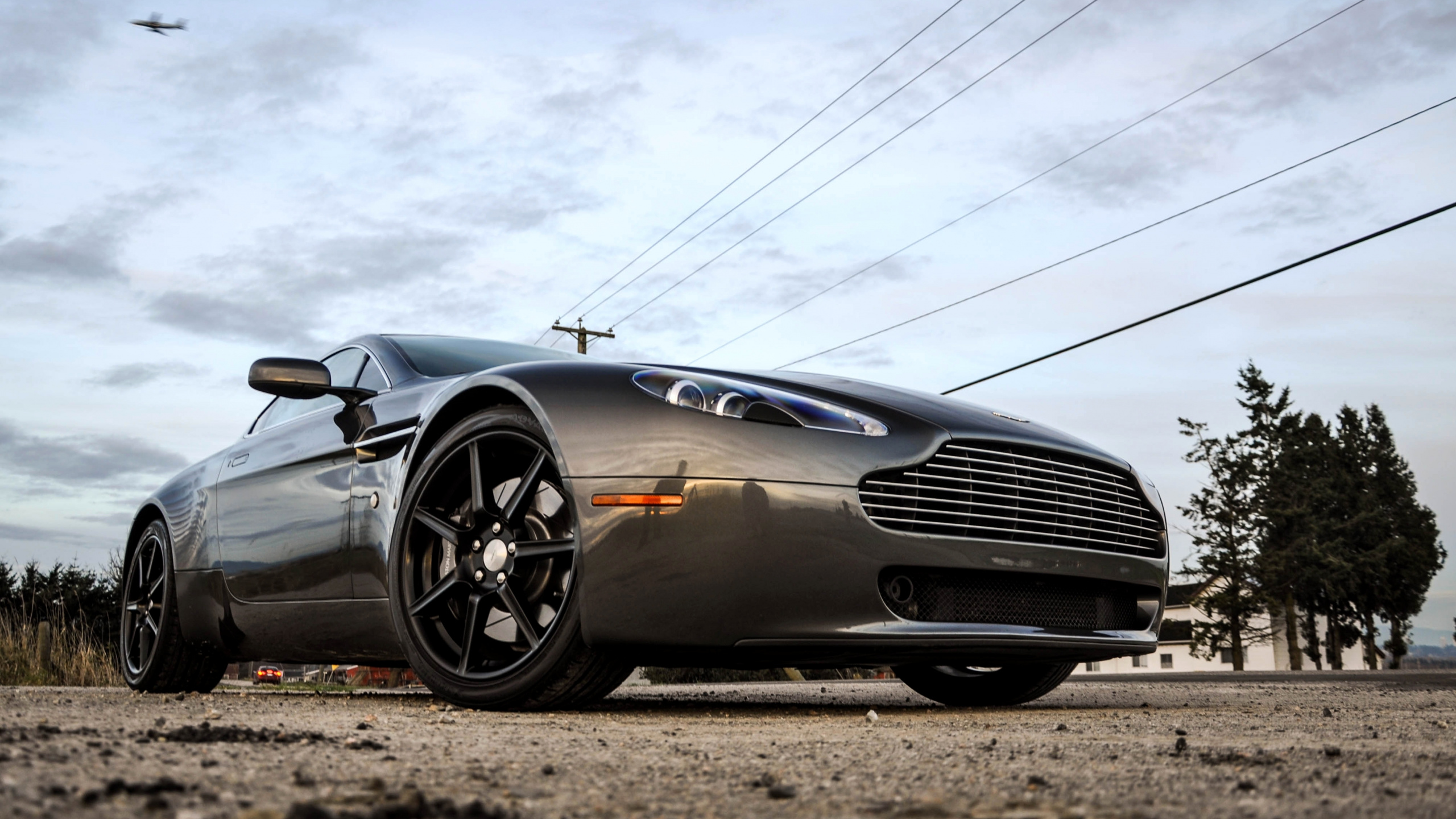 Black Porsche 911 on Road Under White Clouds. Wallpaper in 2560x1440 Resolution