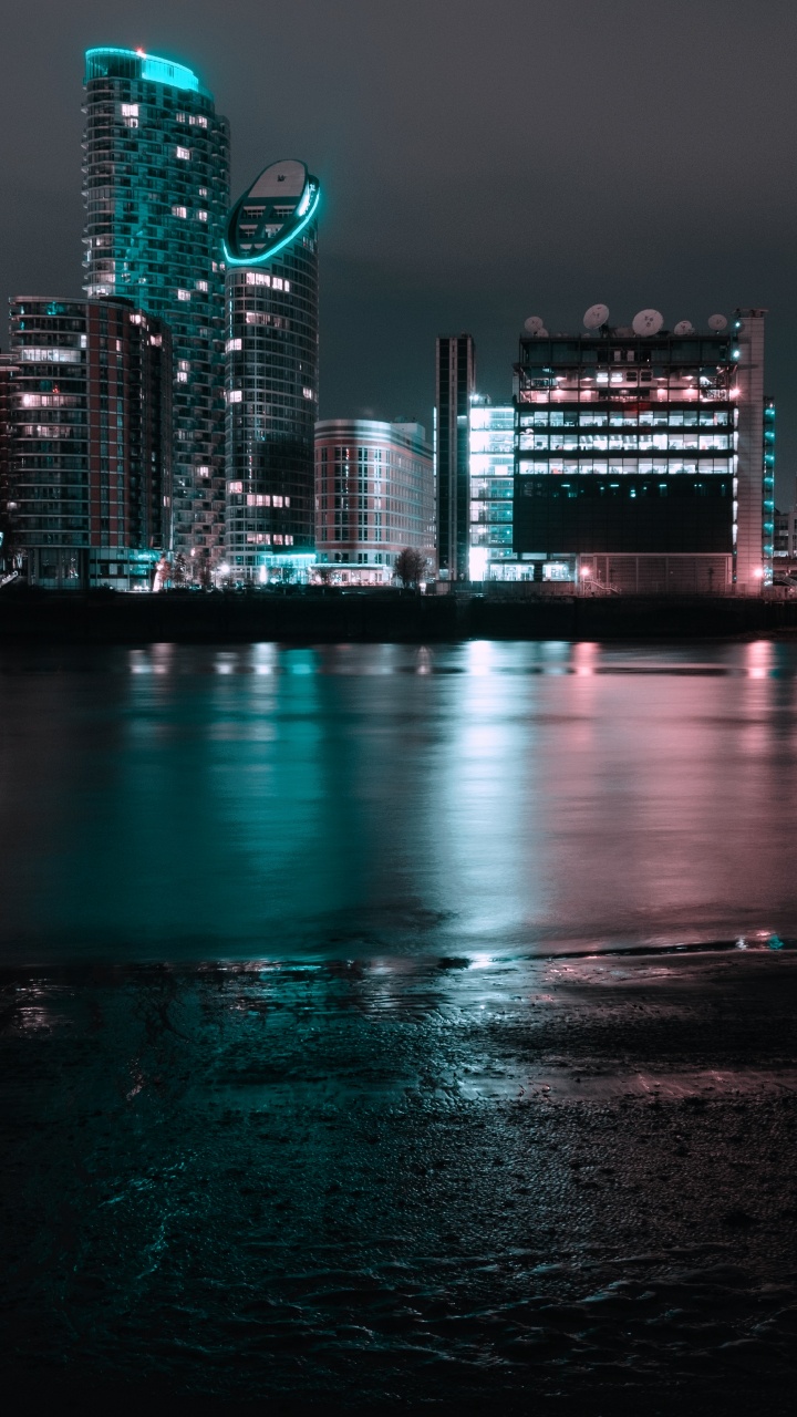 City Skyline During Night Time. Wallpaper in 720x1280 Resolution