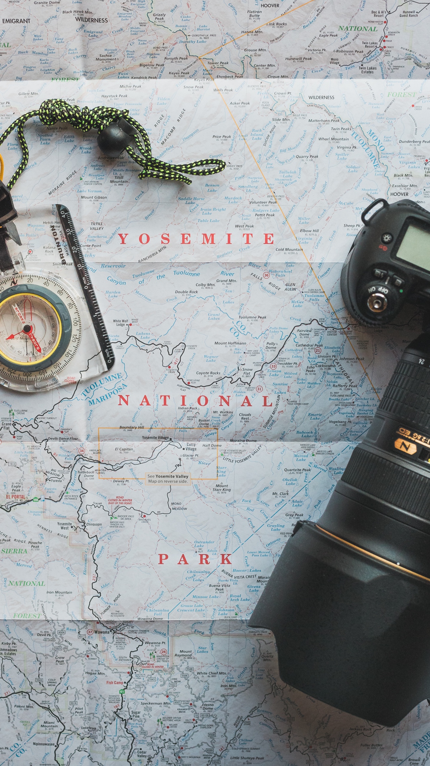 Black Camera Lens on White and Blue Map. Wallpaper in 1440x2560 Resolution