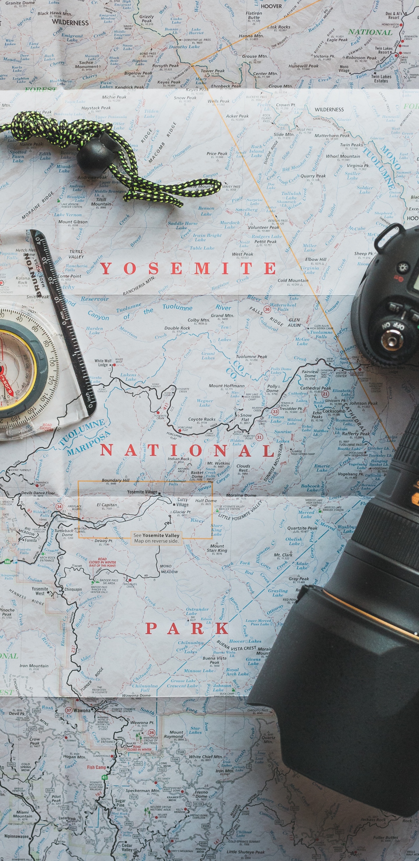 Black Camera Lens on White and Blue Map. Wallpaper in 1440x2960 Resolution