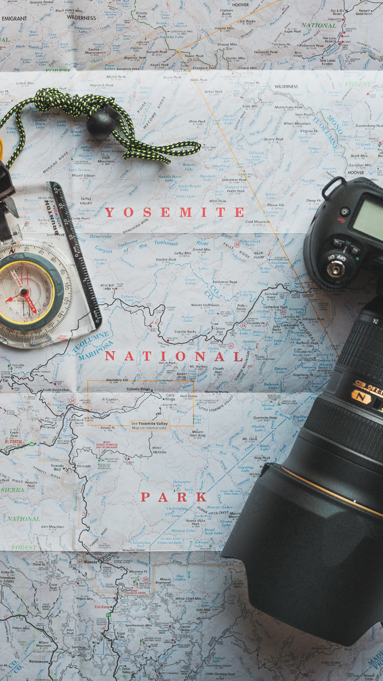 Black Camera Lens on White and Blue Map. Wallpaper in 750x1334 Resolution